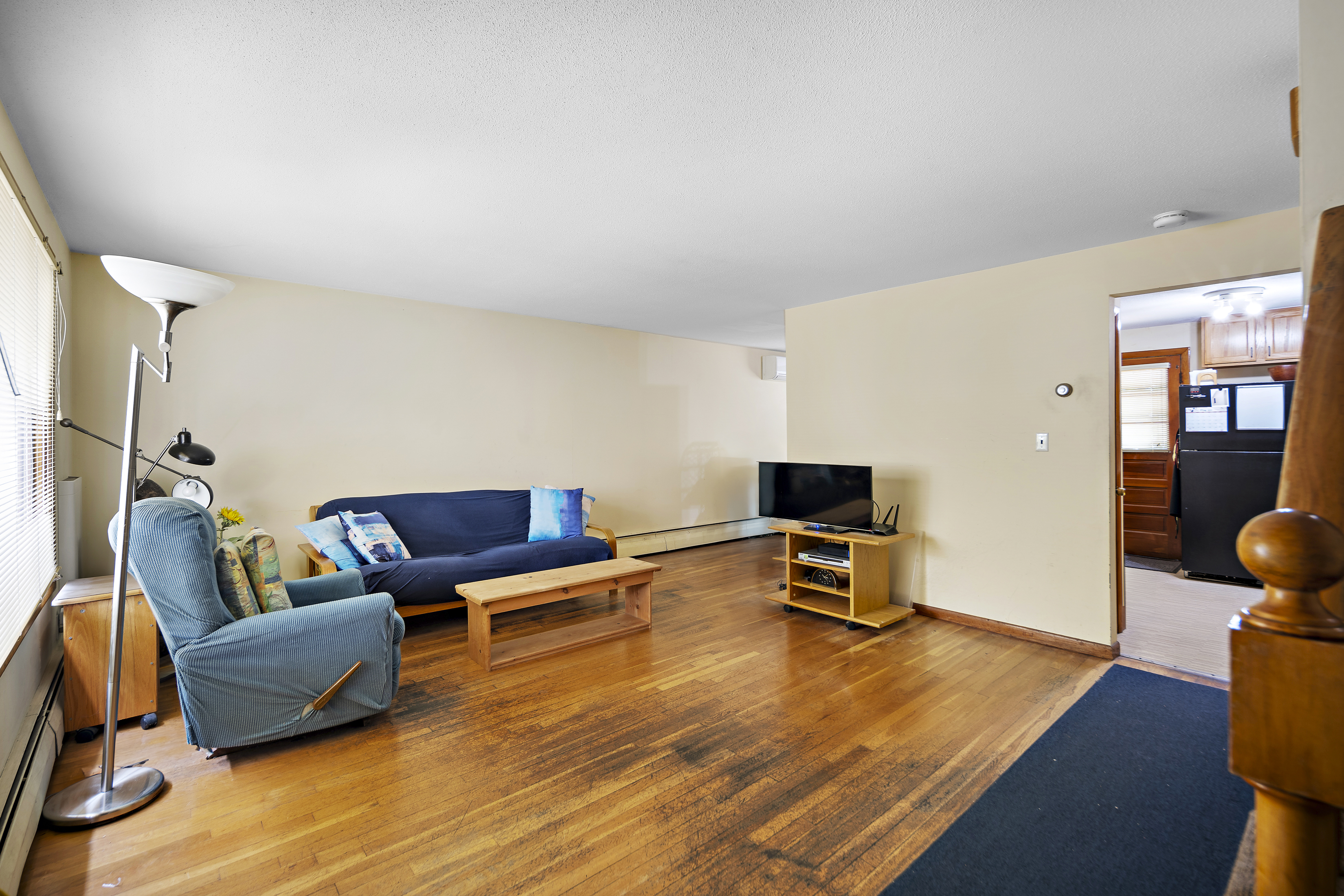 15 Harrington Road Cambridge, MA 02140 - Photo 3 of 17 a living room with furniture and a flat screen tv