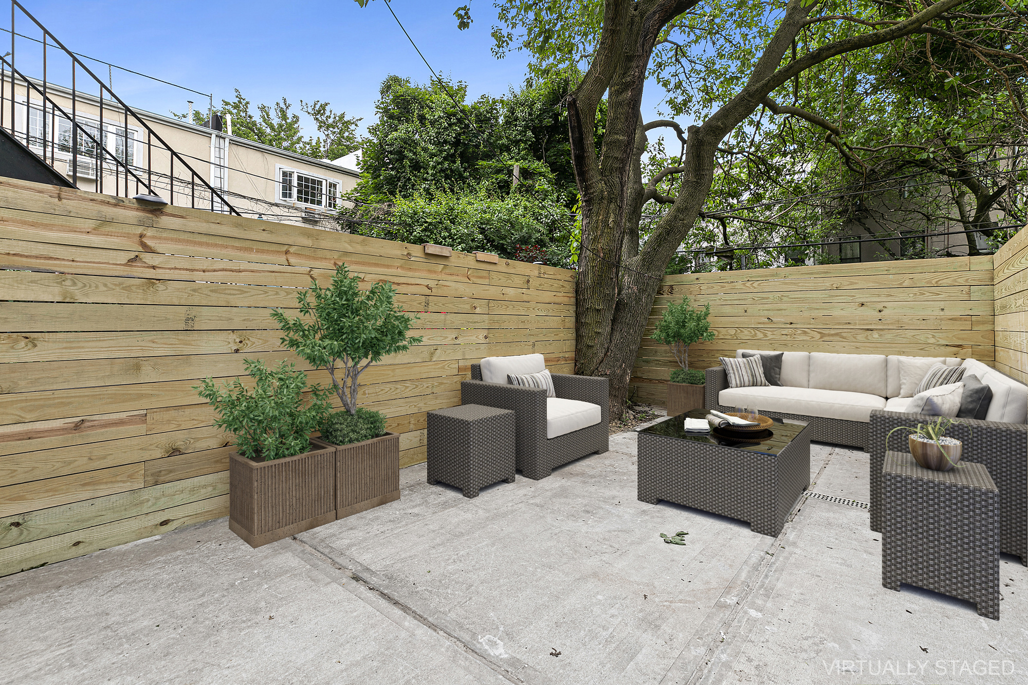 162 Cornelia Street, Unit 1 Brooklyn, NY 11221 - Photo 3 of 11 a backyard of a house with outdoor seating