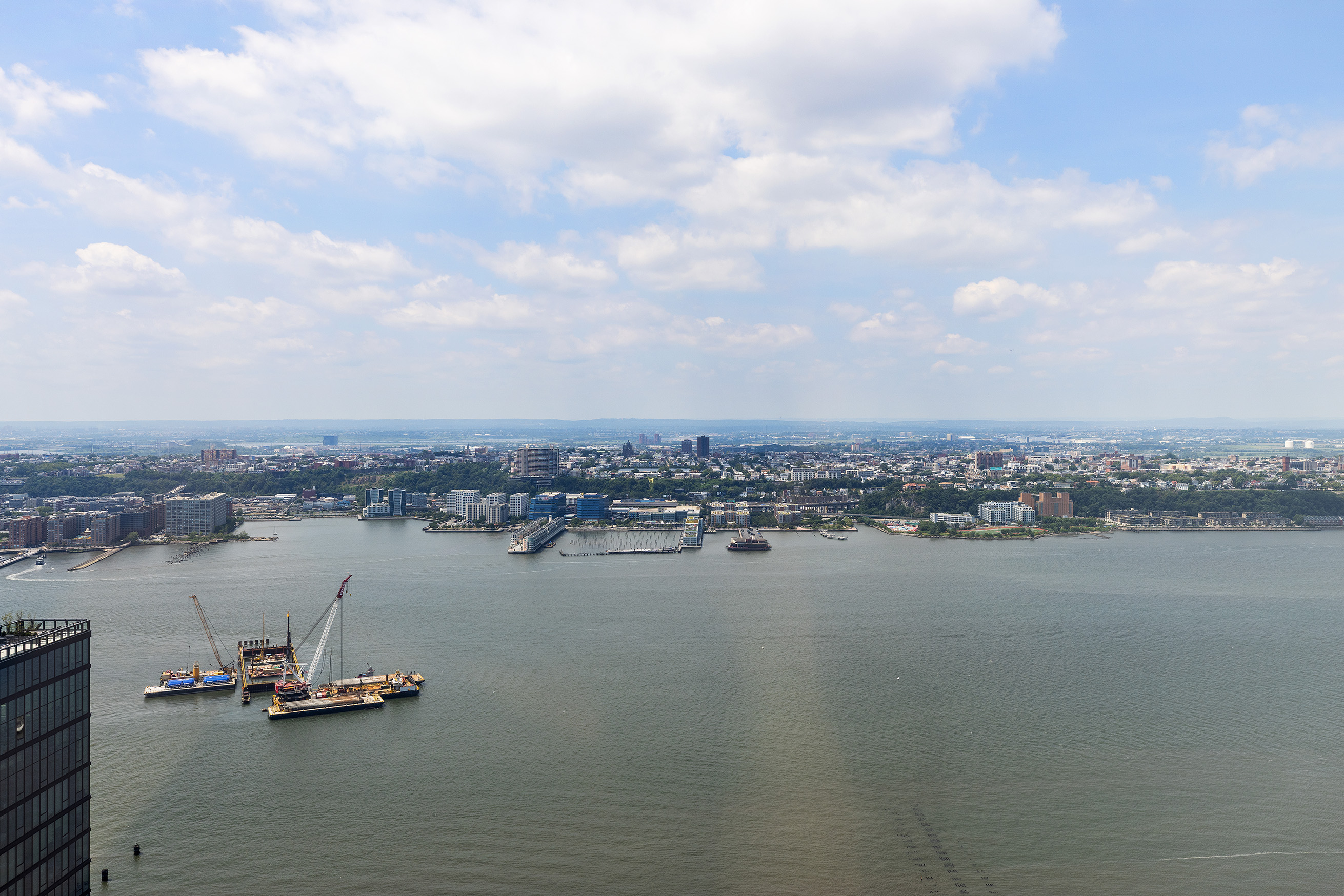 15 Hudson Yards, Unit 68C Manhattan, NY 10001 - Photo 15 of 16 a view of a lake with houses