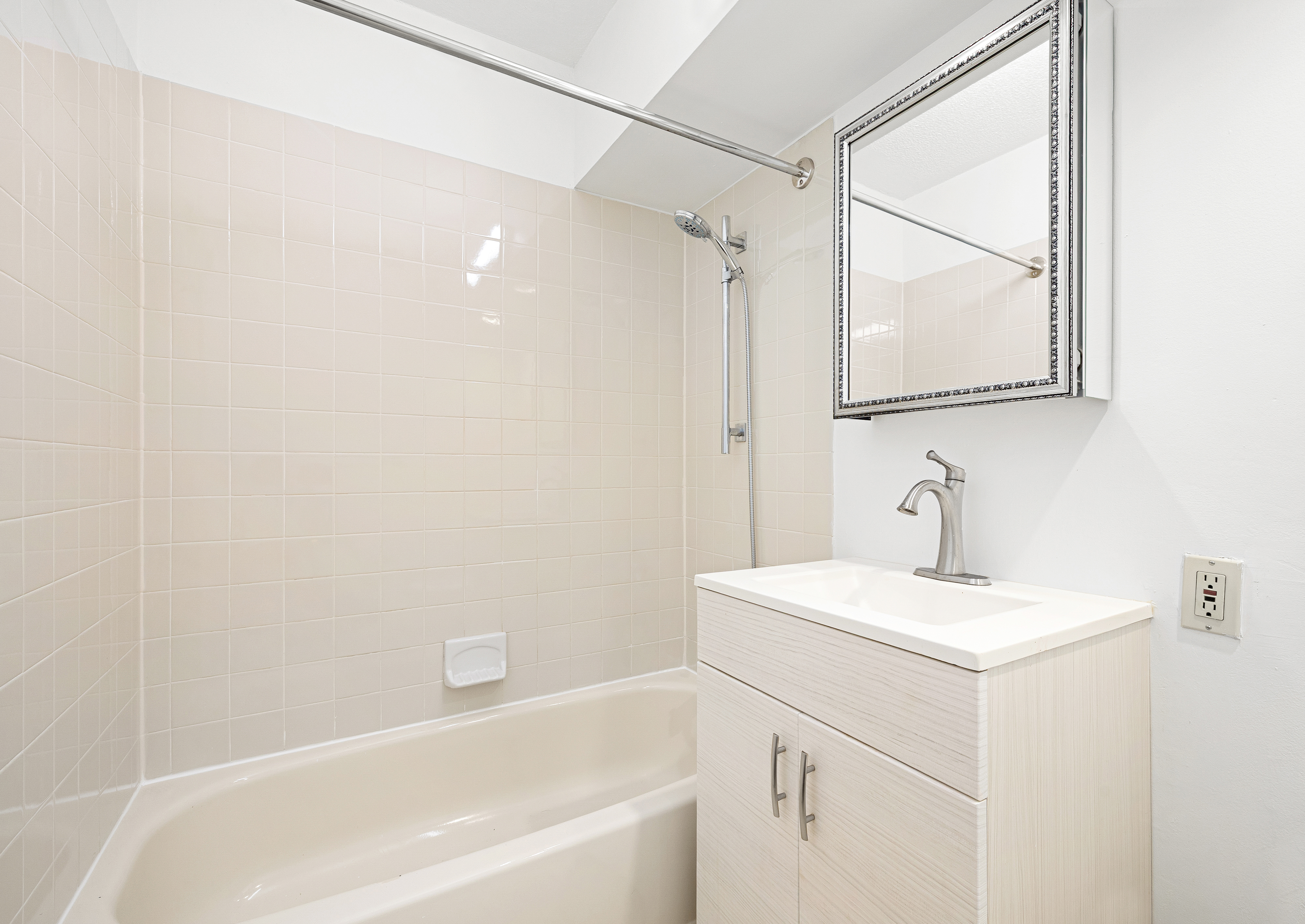 376 Broadway, Unit 9D Manhattan, NY 10013 - Photo 7 of 8 a bathroom with a sink and a bathtub