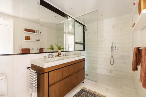 a bathroom with a sink and mirror