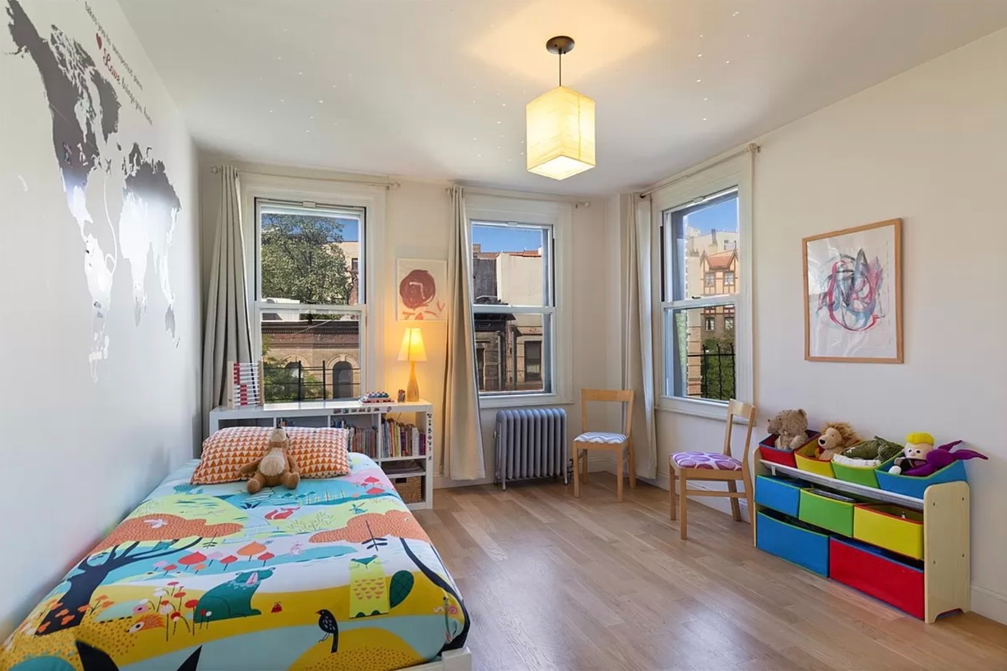 807 Riverside Drive, Unit 4B Manhattan, NY 10032 - Photo 7 of 12 a bedroom with a bed and wooden floor