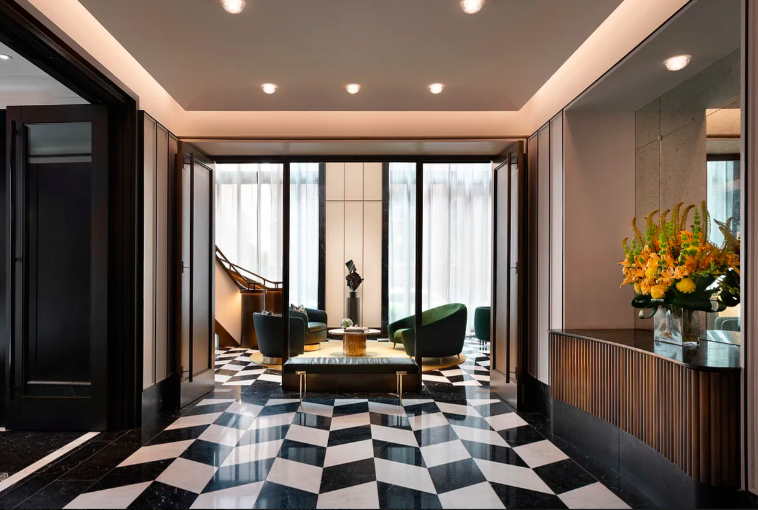 40 East End Avenue, Unit 9B Manhattan, NY 10028 - Photo 21 of 25 a room with a black white checkered floor with a gaming machine and dining table