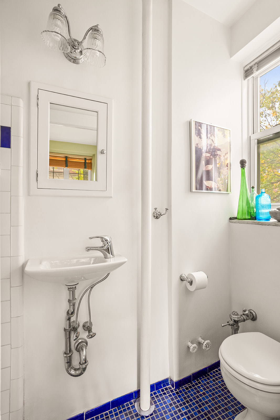 34-27 79th Street, Unit 42 Queens, NY 11372 - Photo 6 of 15 a bathroom with a sink and a mirror