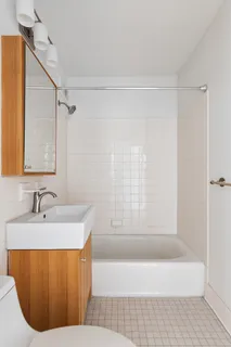 a bathroom with a bathtub and a sink