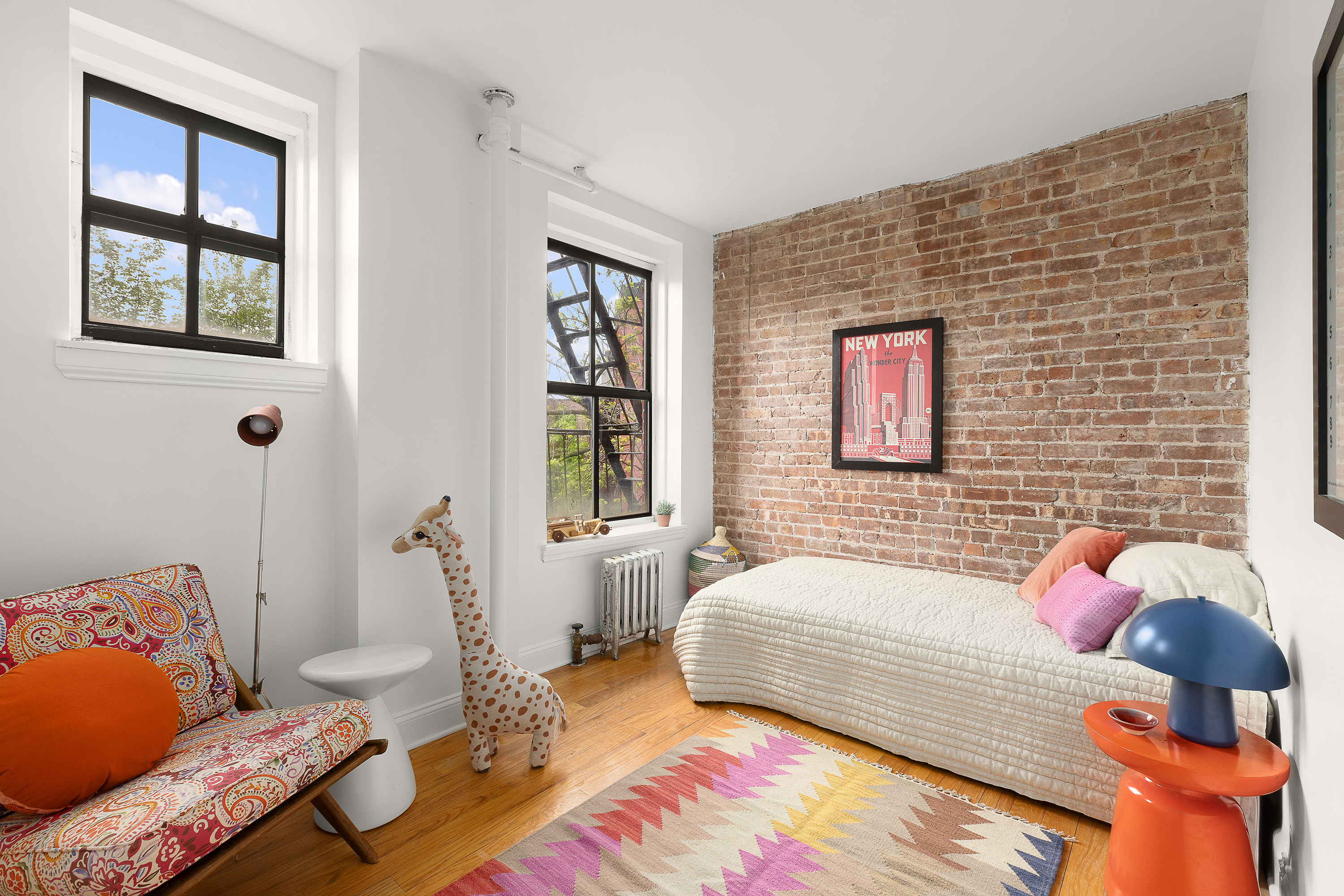 138 Baltic Street, Unit 4C Brooklyn, NY 11201 - Photo 9 of 12 a bedroom with a bed and wooden floor