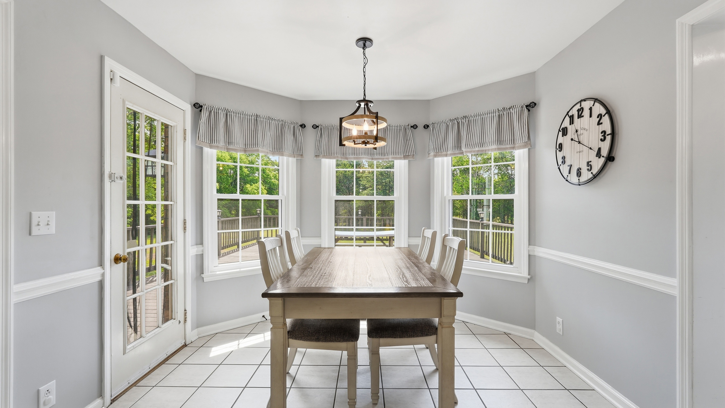 3630 West Trimble Road Milton, TN 37118 - Photo 7 of 9 a dining room with furniture window clock and front door