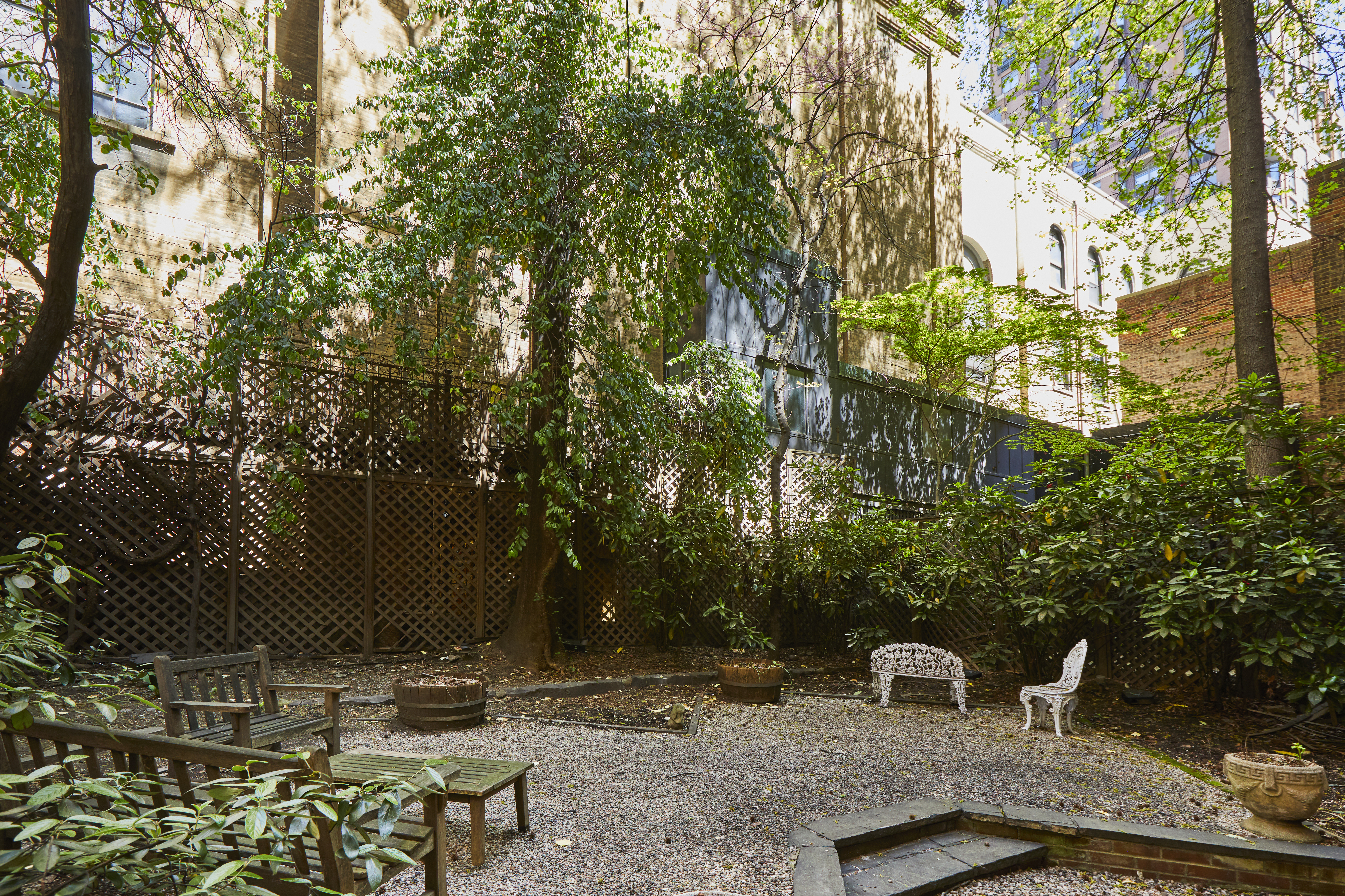 157 East 75th Street, Unit 1E Manhattan, NY 10021 - Photo 20 of 21 a view of a yard with table and chairs