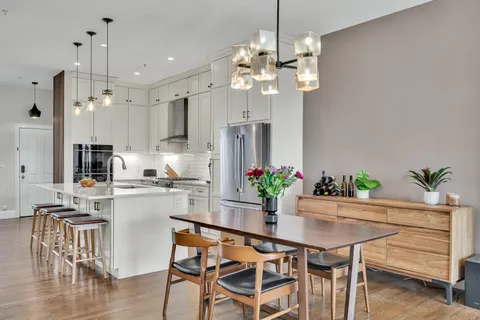 a kitchen with a table and chairs in it