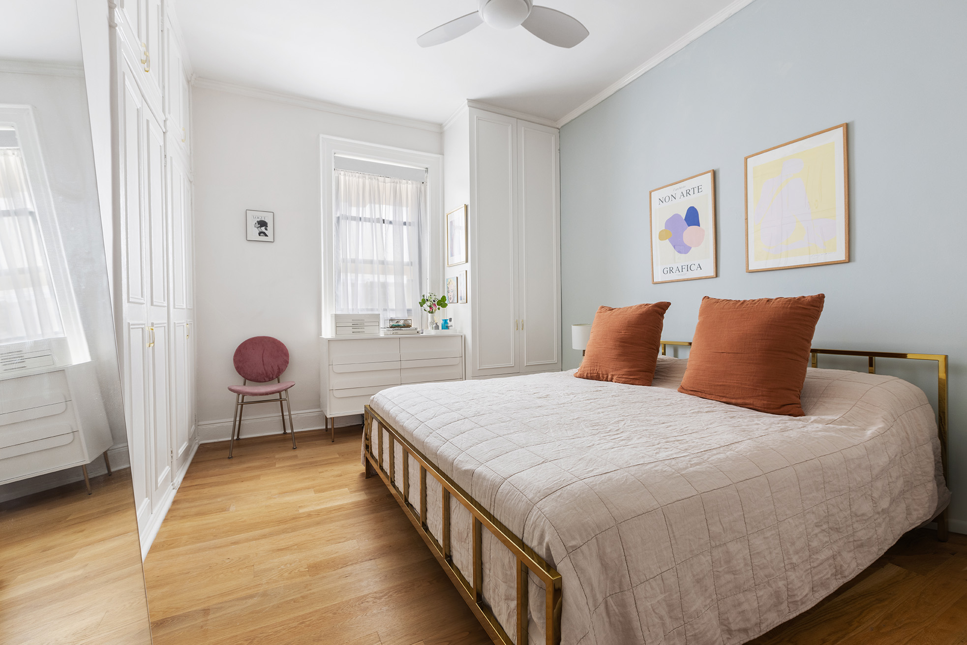 229 West 97th Street, Unit 5M New York, NY 10025 - Photo 6 of 11 a bedroom with a bed and a window