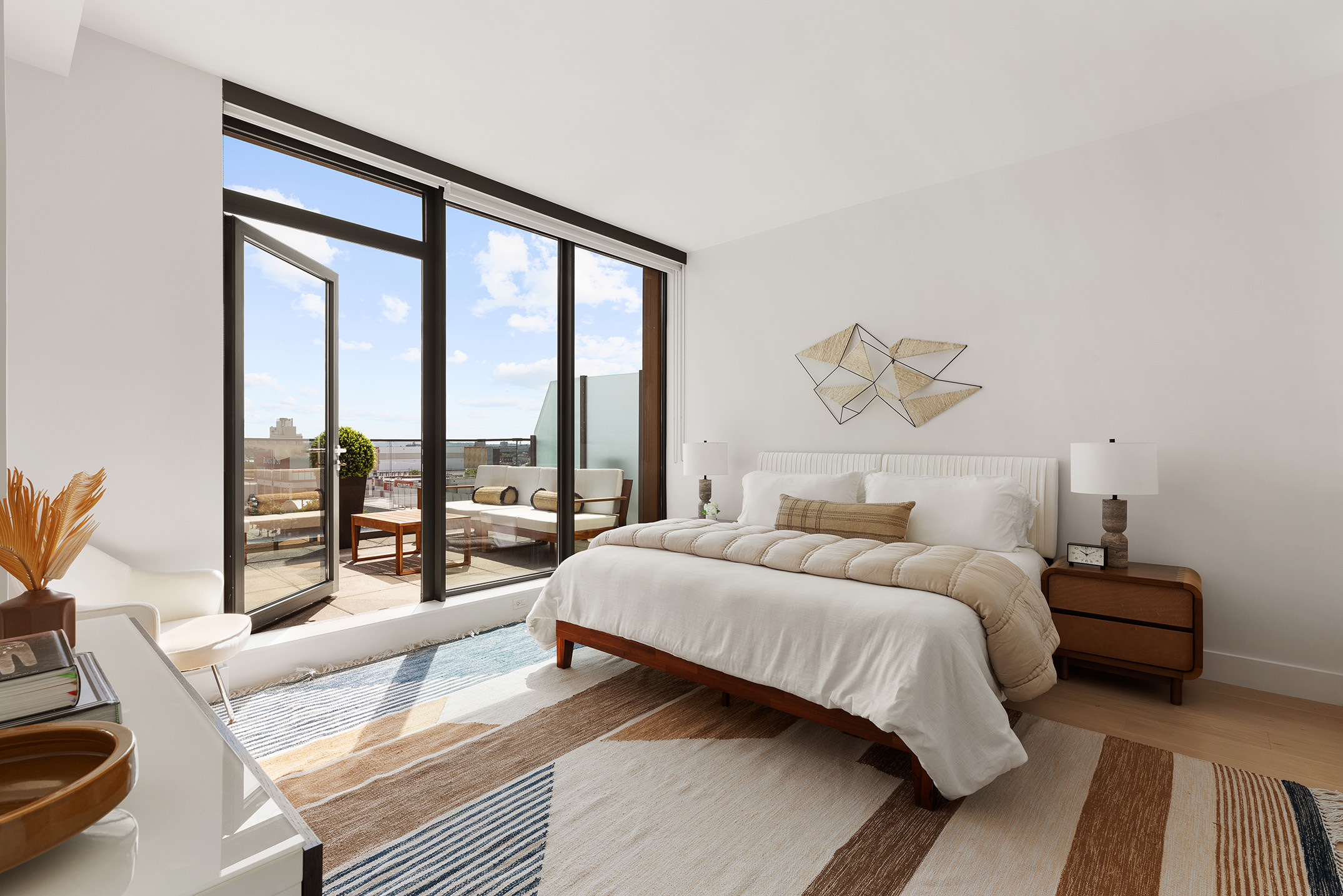 251 1st Street, Unit 7F Brooklyn, NY 11215 - Photo 7 of 24 a bedroom with a bed and a large window