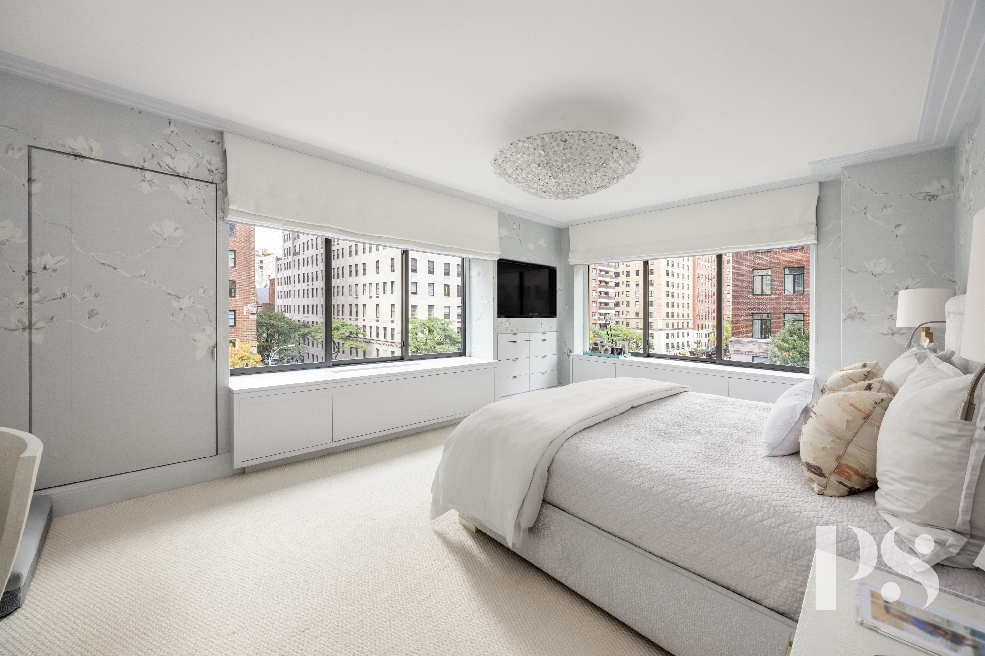 733 Park Avenue, Unit 4 Manhattan, NY 10021 - Photo 19 of 29 a bedroom with a large bed and a large window