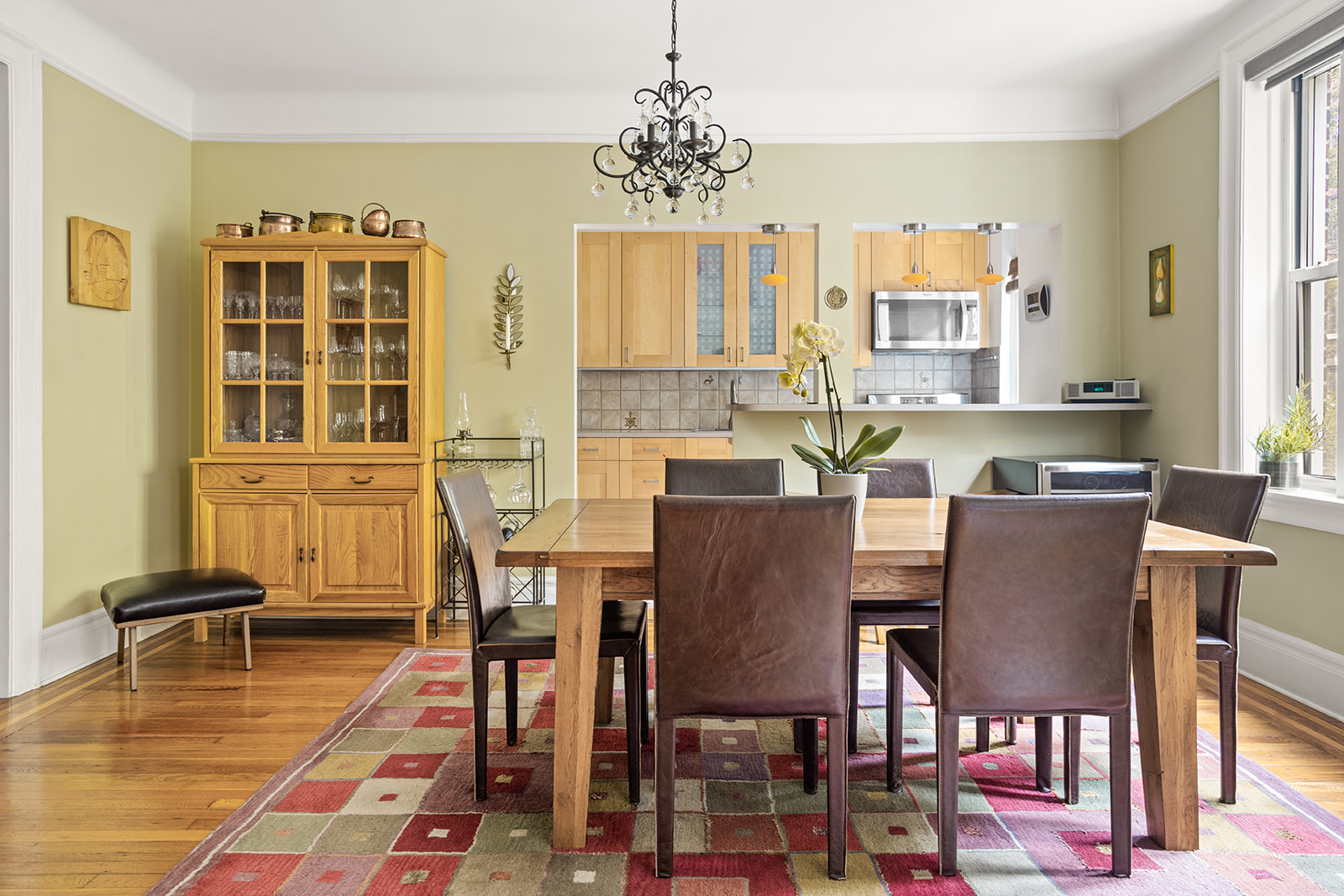 35-56 79th Street, Unit 22 Queens, NY 11372 - Photo 4 of 14 a dining room with wooden floor and large windows