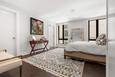 a bed room with a bed and a dresser