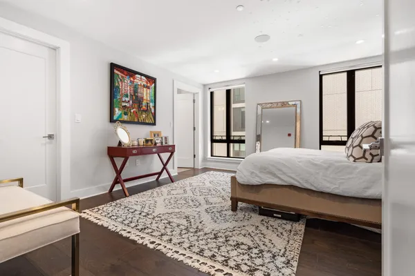 a bed room with a bed and a dresser