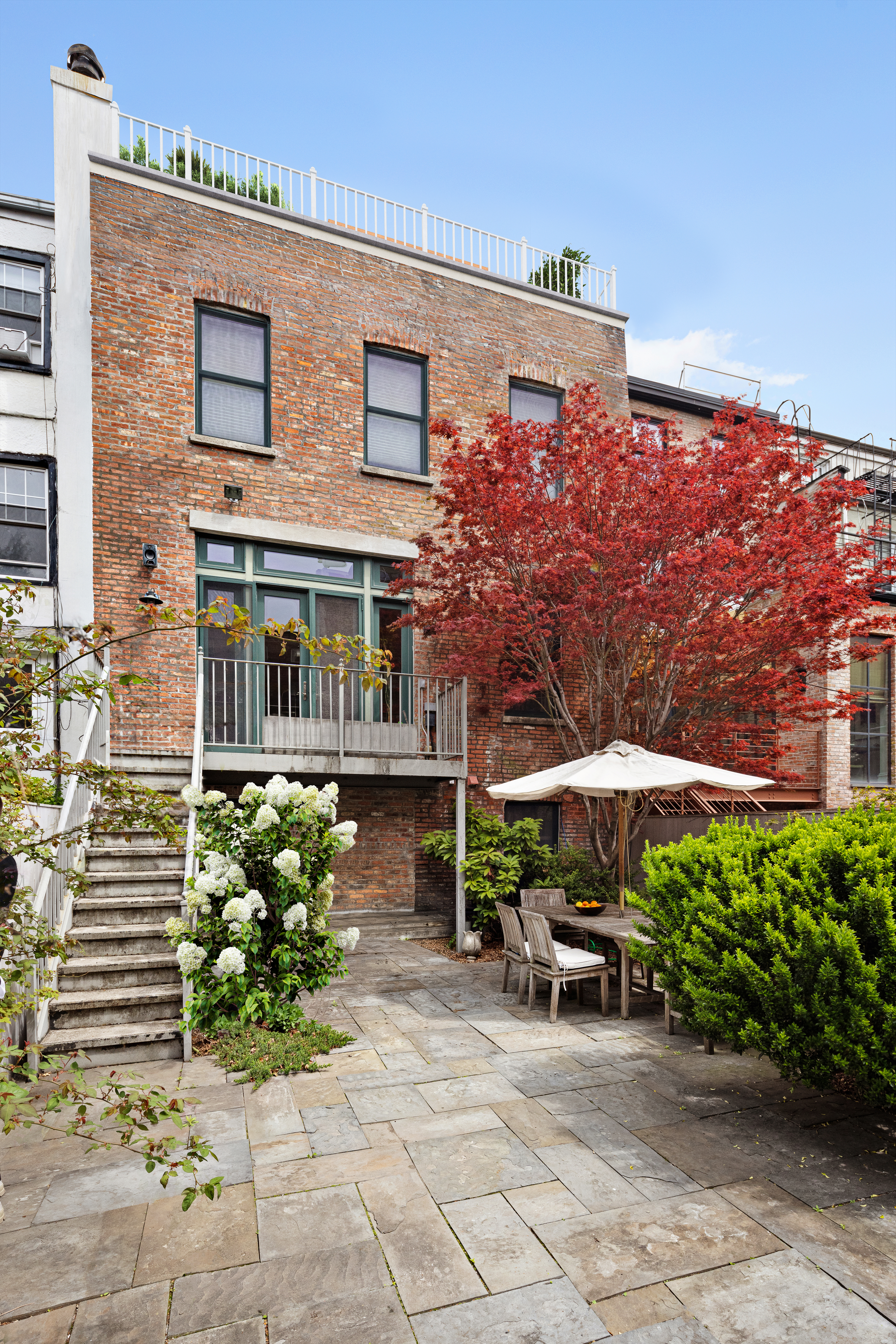 126 Pacific Street Brooklyn, NY 11201 - Photo 4 of 16 a front view of a house with garden