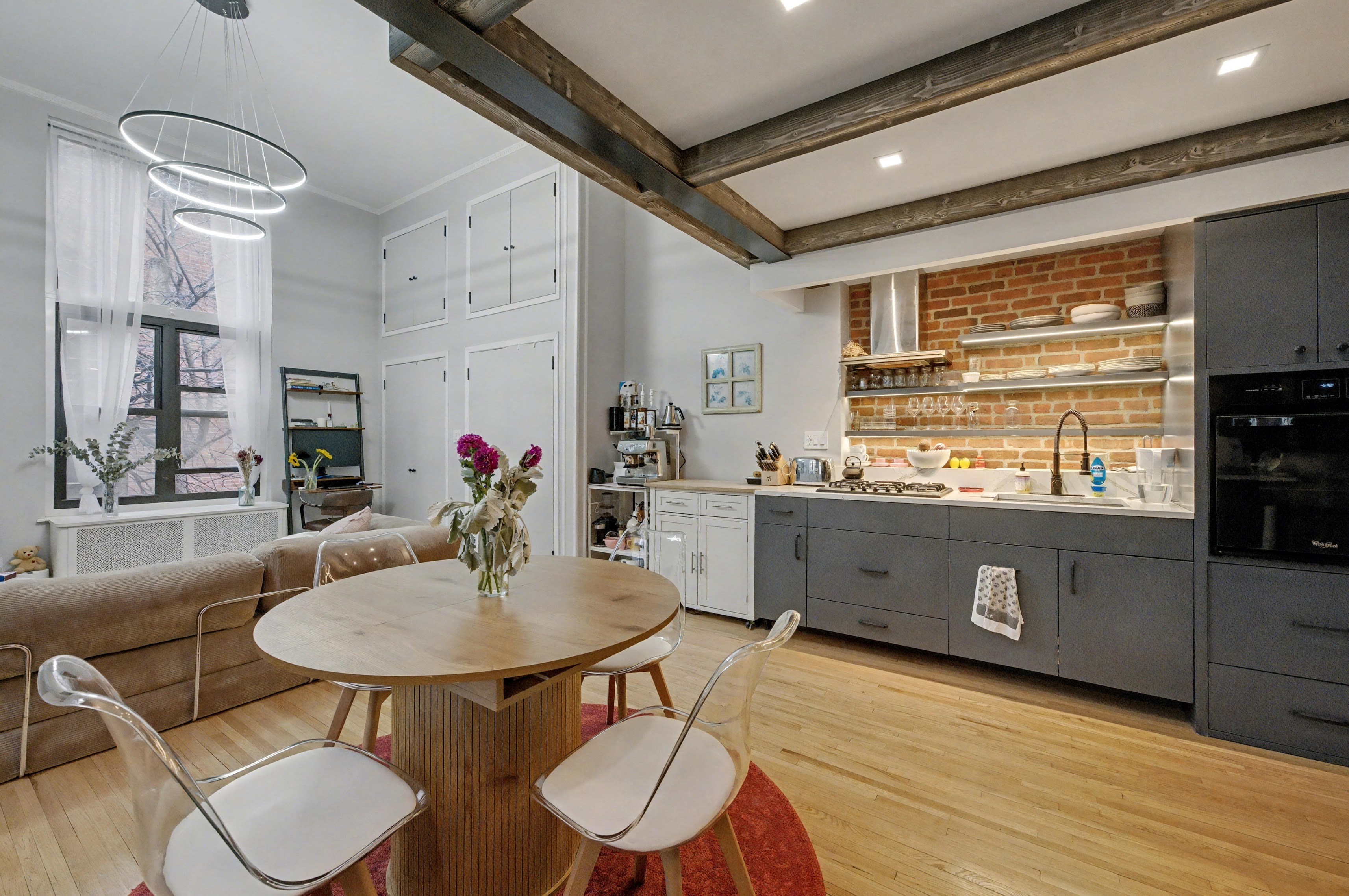 132 Joralemon Street, Unit 2C Brooklyn, NY 11201 - Photo 2 of 12 a kitchen with stainless steel appliances granite countertop a kitchen island a white cabinets a sink and a refrigerator