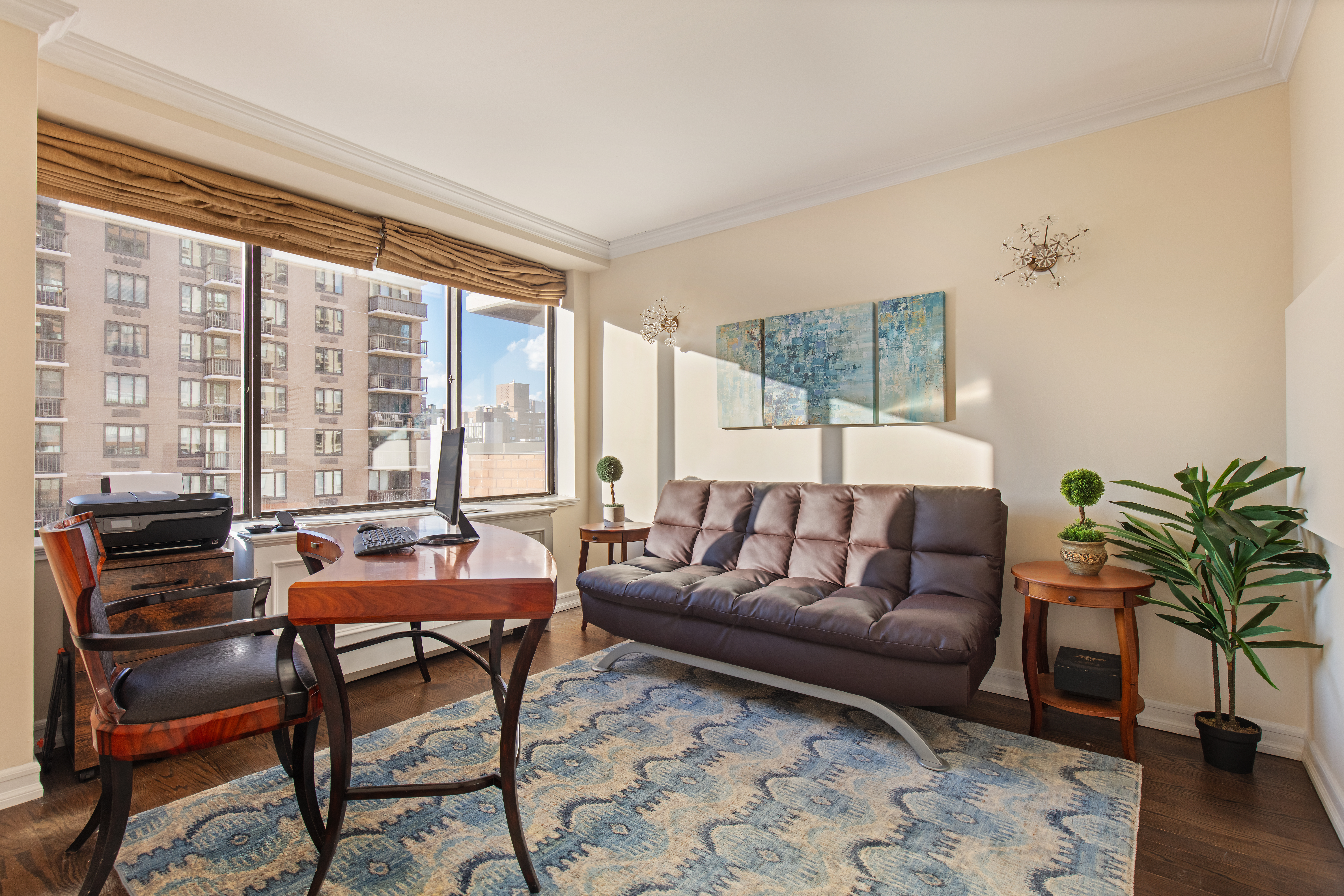 1441 3rd Avenue, Unit 14AB Manhattan, NY 10028 - Photo 8 of 16 a living room with furniture and a window
