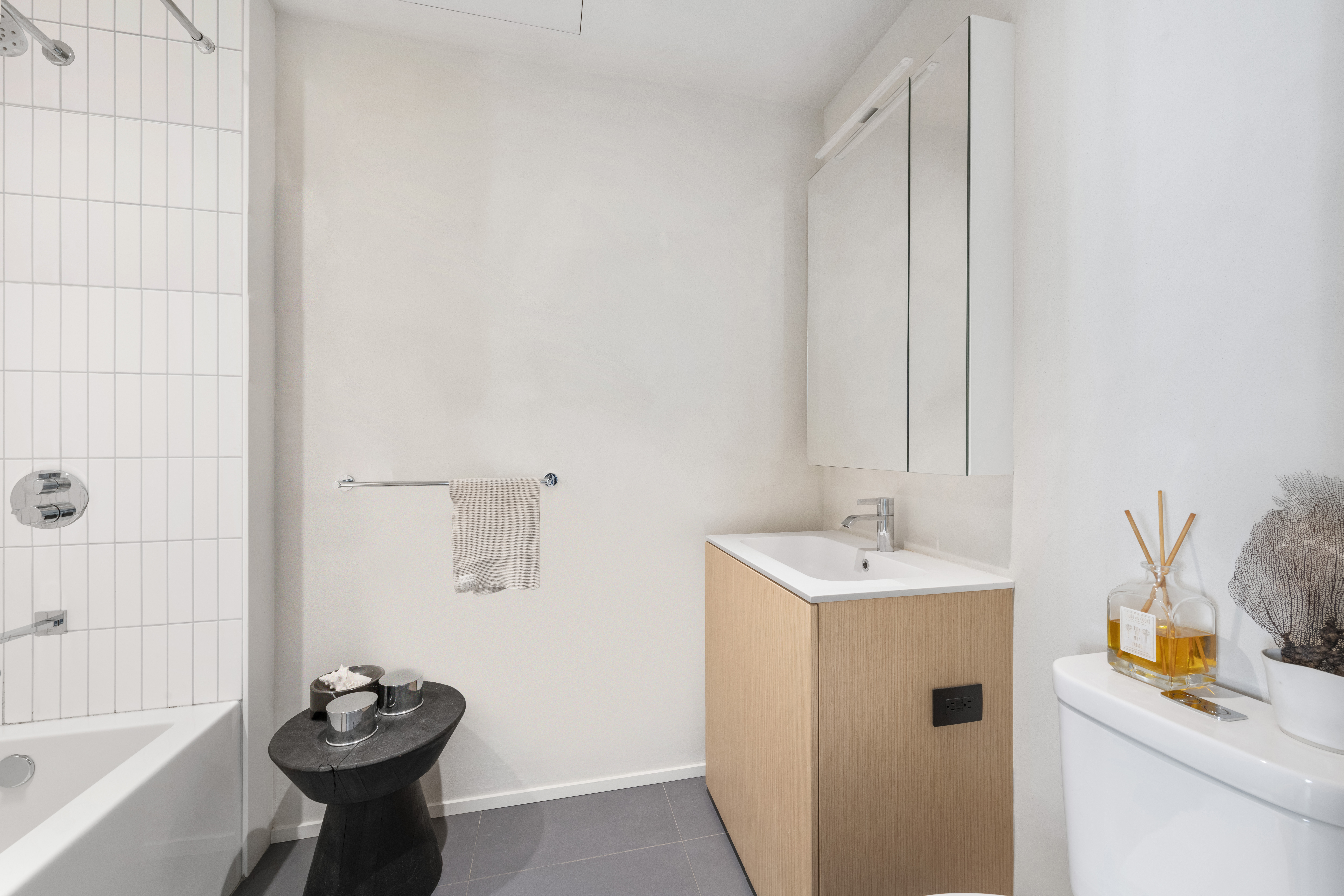 168 Plymouth Street, Unit 5A Brooklyn, NY 11201 - Photo 11 of 19 a bathroom with a sink a toilet and shower