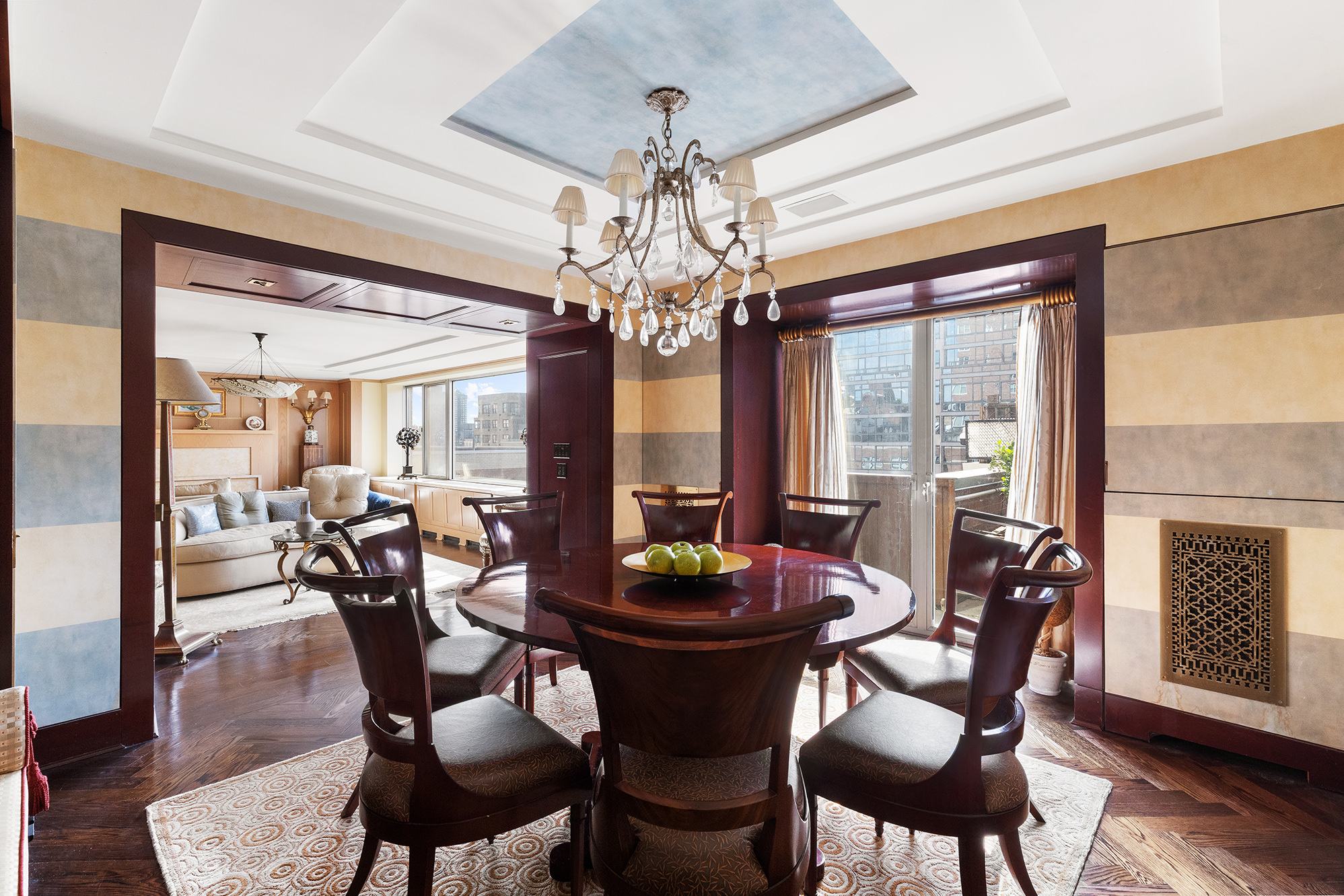 360 East 72nd Street, Unit C1801 Manhattan, NY 10021 - Photo 4 of 20 a view of a dining room with furniture window and wooden floor