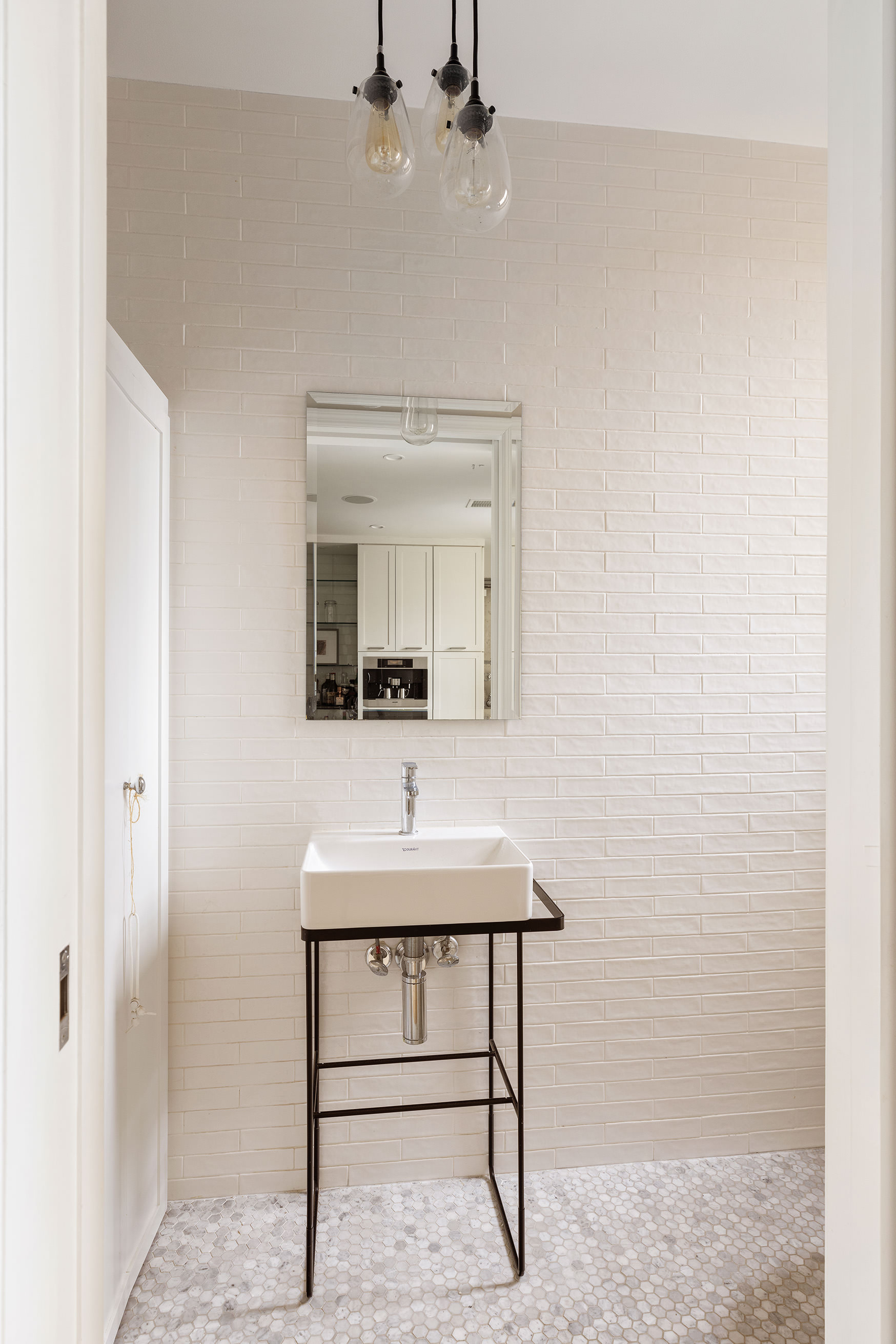 180 East 79th Street, Unit 14G Manhattan, NY 10075 - Photo 10 of 12 a bathroom with a sink and a mirror