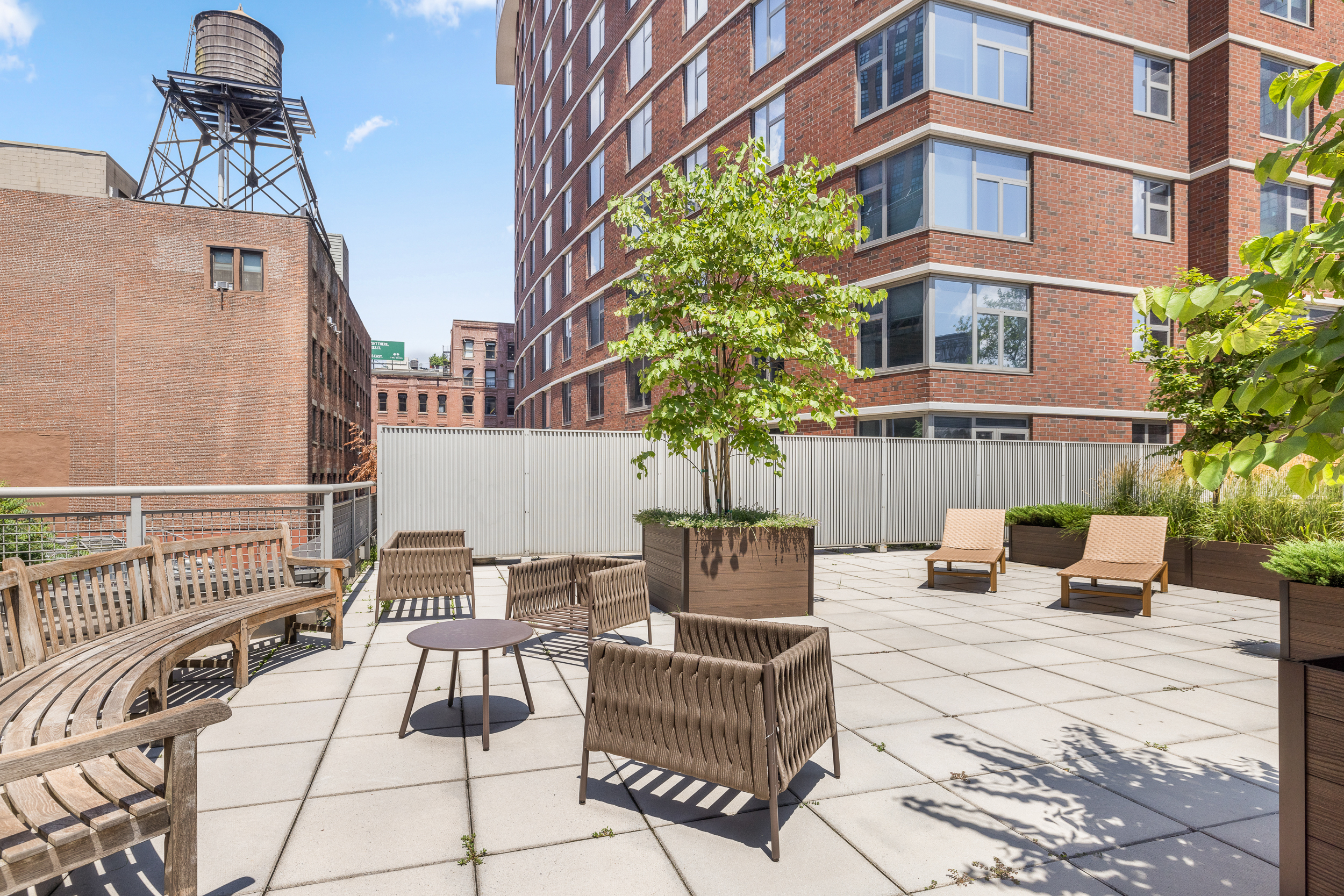 100 Jay Street, Unit 20F Brooklyn, NY 11201 - Photo 17 of 20 a view of a patio with couches table and chairs and potted plants