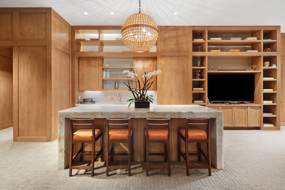 200 East 94th Street, Unit 615 Manhattan, NY 10128 - Photo 8 of 11 a kitchen with stainless steel appliances granite countertop a stove and a wooden floor