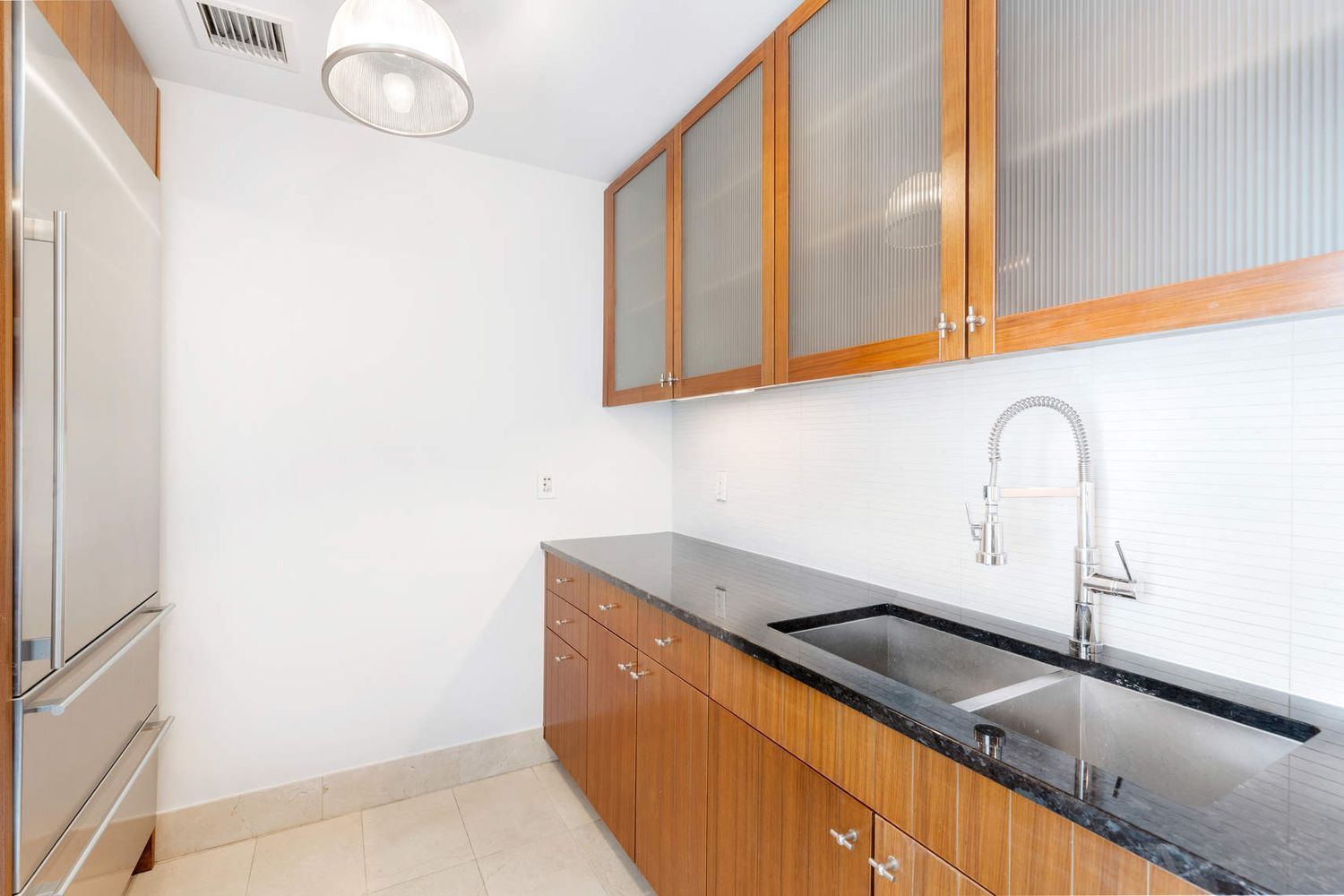 250 East 53rd Street, Unit 1001 Manhattan, NY 10022 - Photo 7 of 18 a close view of sink and tap