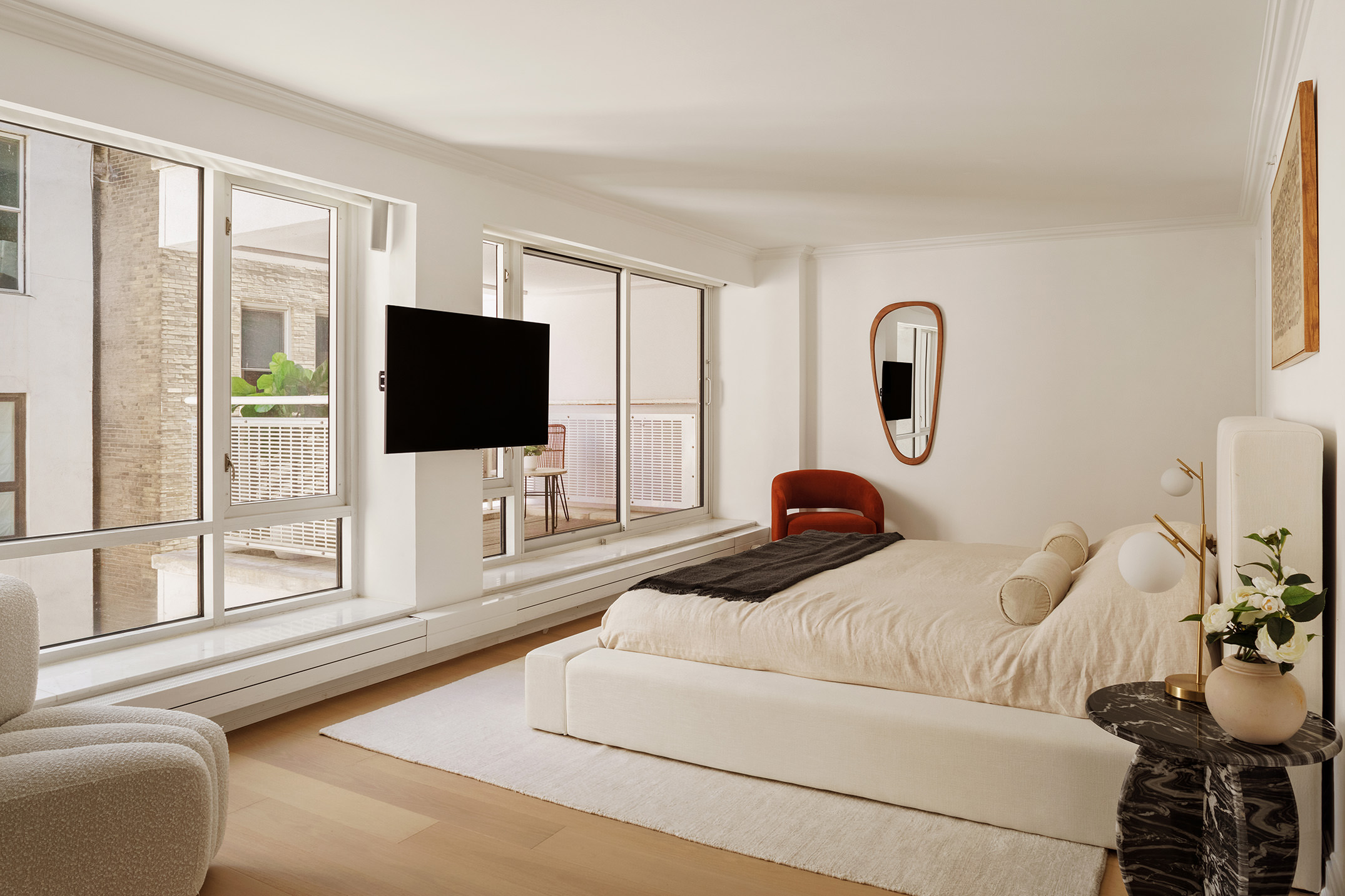 16 Warren Street, Unit 5 Manhattan, NY 10007 - Photo 7 of 18 a bedroom with a bed and a flat screen tv