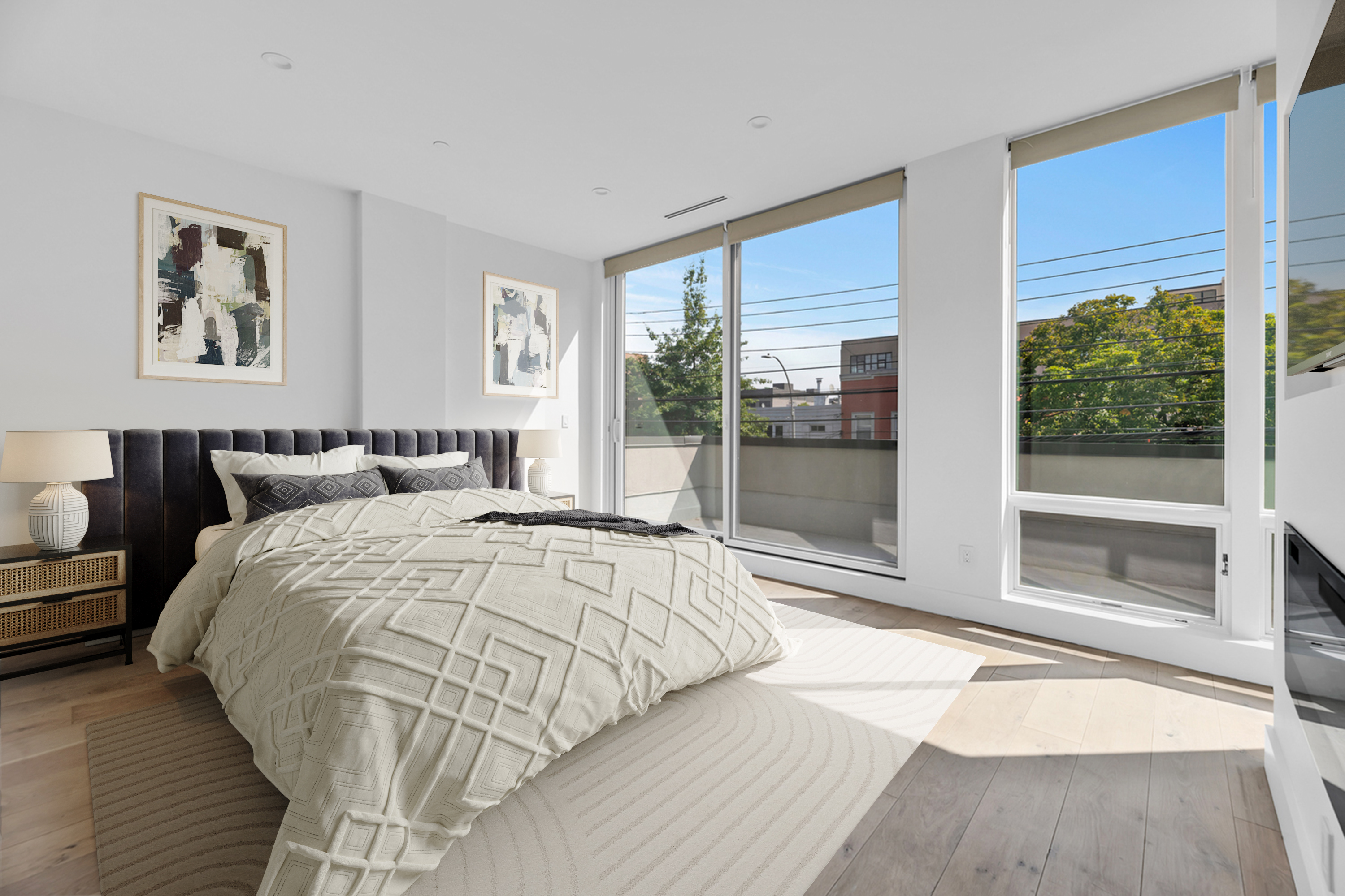 38-26 29th Street, Unit 2 Queens, NY 11101 - Photo 5 of 14 a bedroom with a large bed and a large window