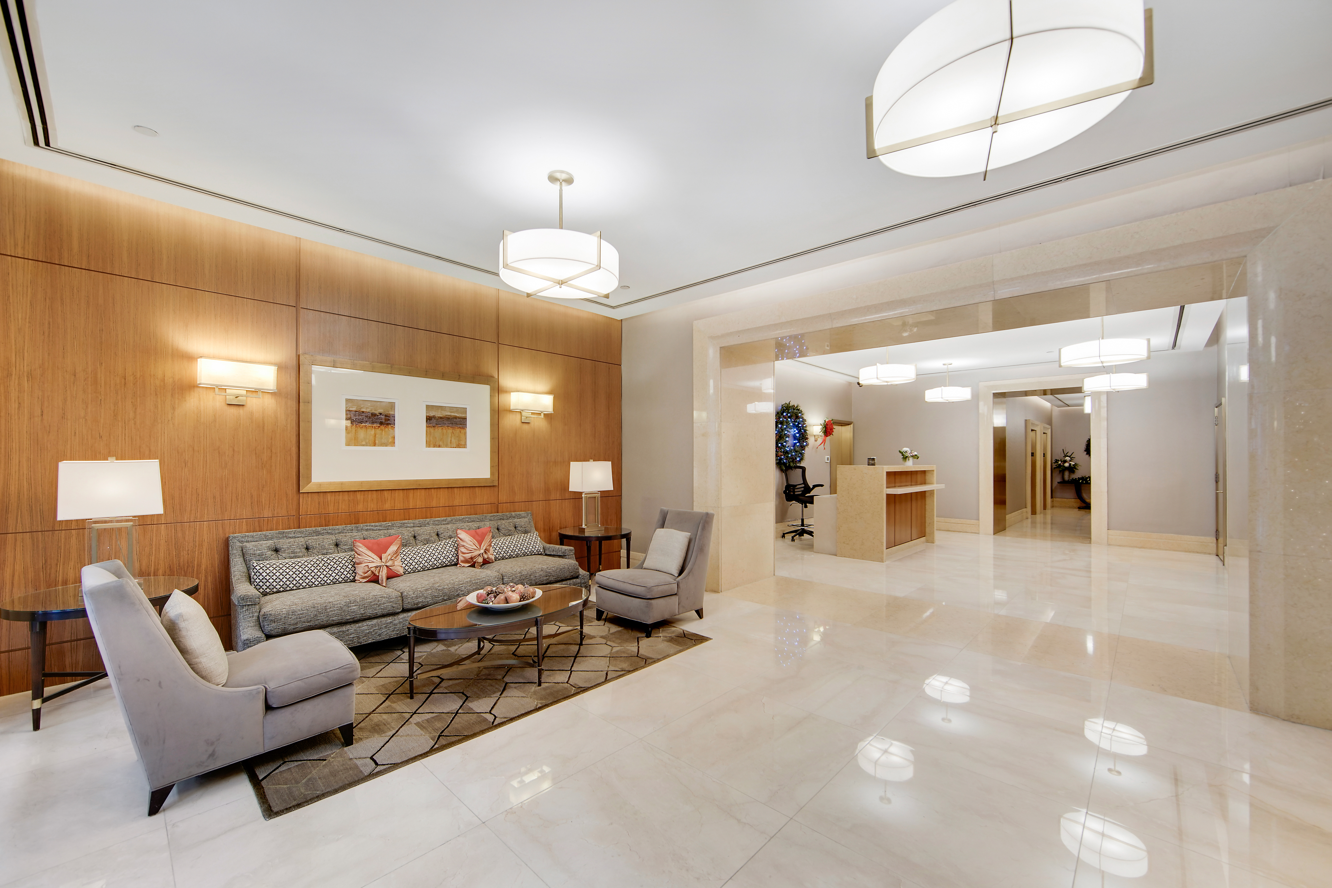 45 Park Avenue, Unit 202 Manhattan, NY 10016 - Photo 15 of 17 a lobby with furniture and a chandelier