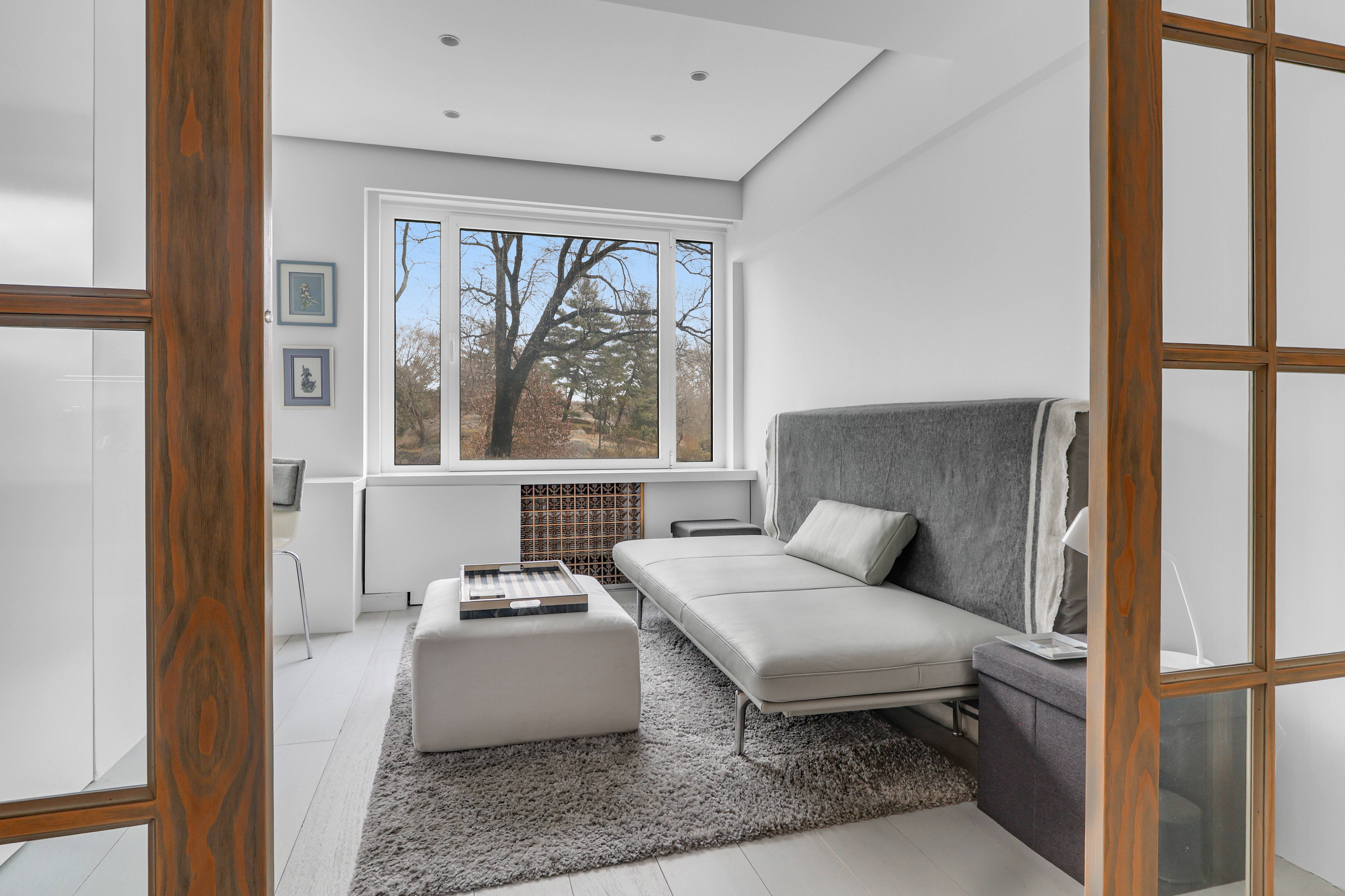 120 Central Park South, Unit 2 B C Manhattan, NY 10019 - Photo 6 of 13 a living room with furniture and a large window