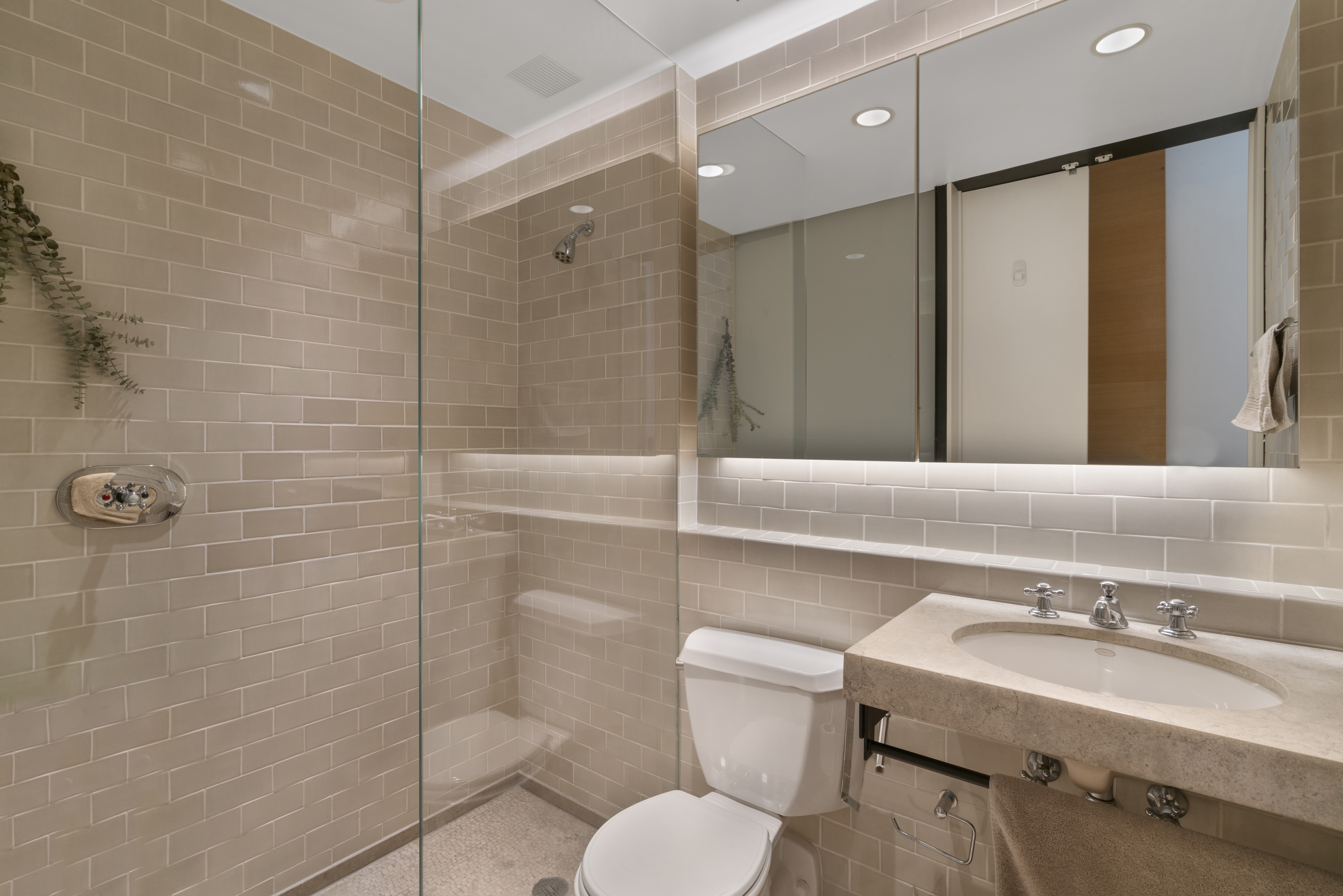 312 East 23rd Street, Unit 7B Manhattan, NY 10010 - Photo 9 of 14 a bathroom with a sink toilet and shower