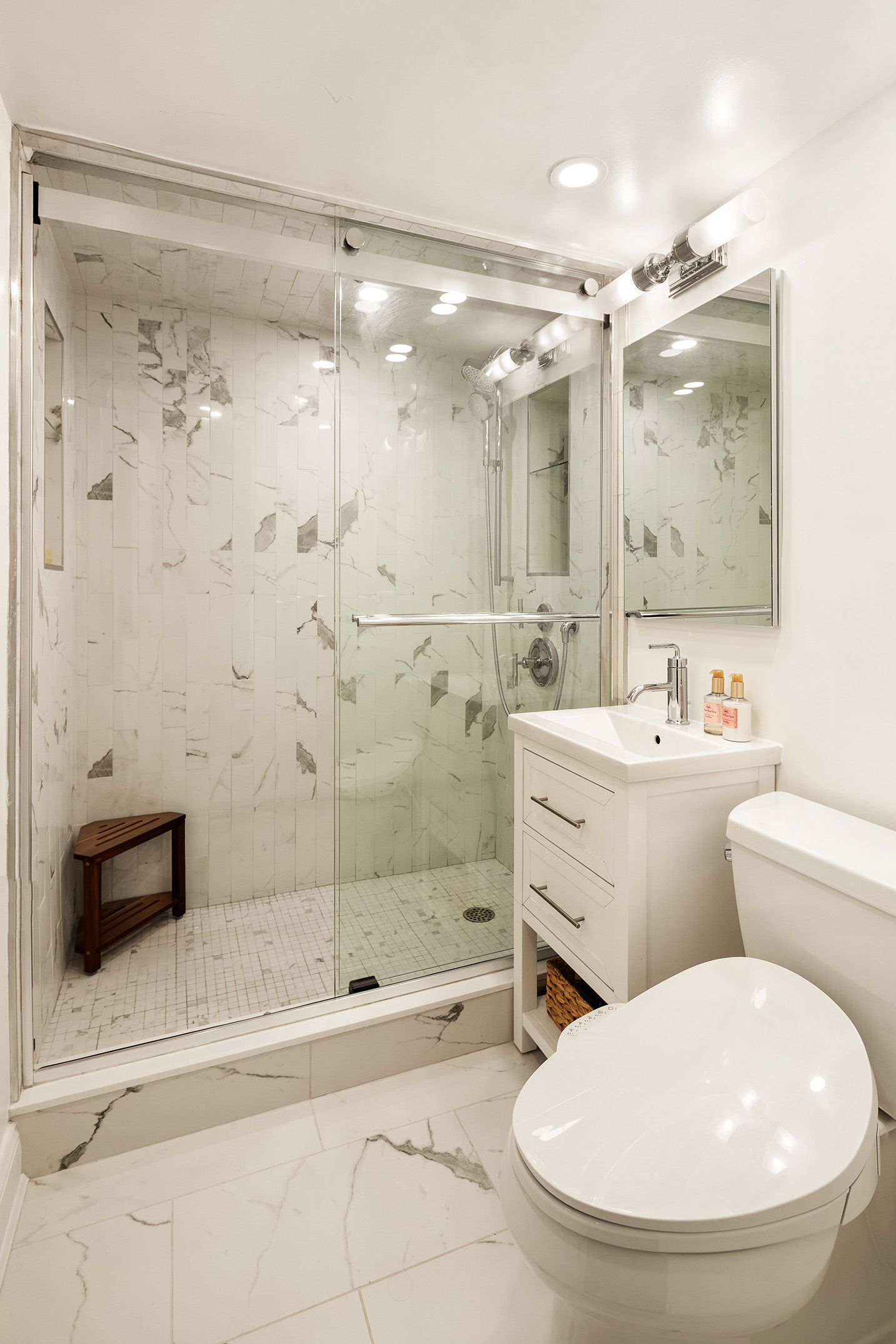 250 Mercer Street, Unit C302 Manhattan, NY 10012 - Photo 10 of 24 a bathroom with a sink toilet and shower