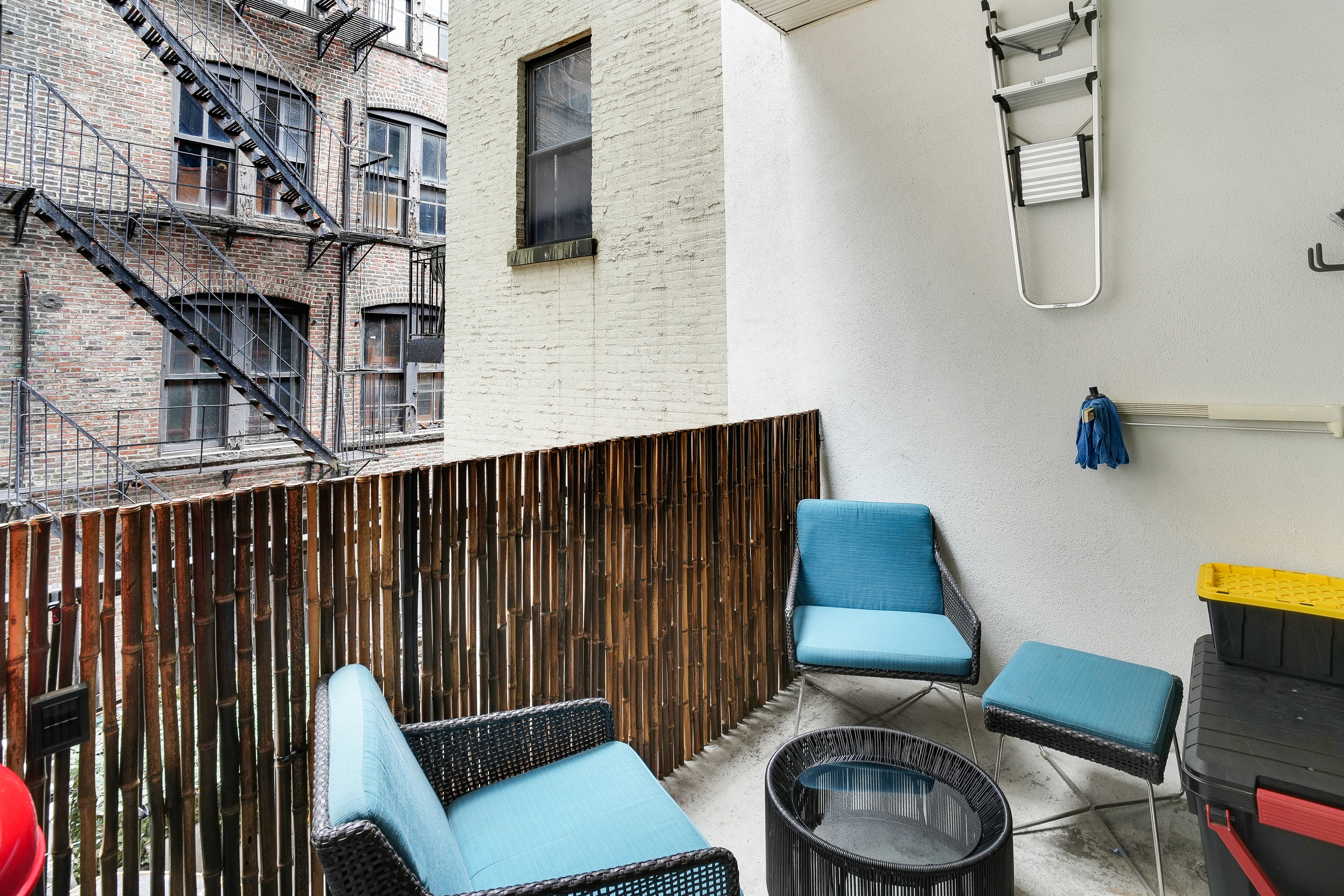 35 East 10th Street, Unit 3G Manhattan, NY 10003 - Photo 7 of 9 a blue chair sitting in front of a building