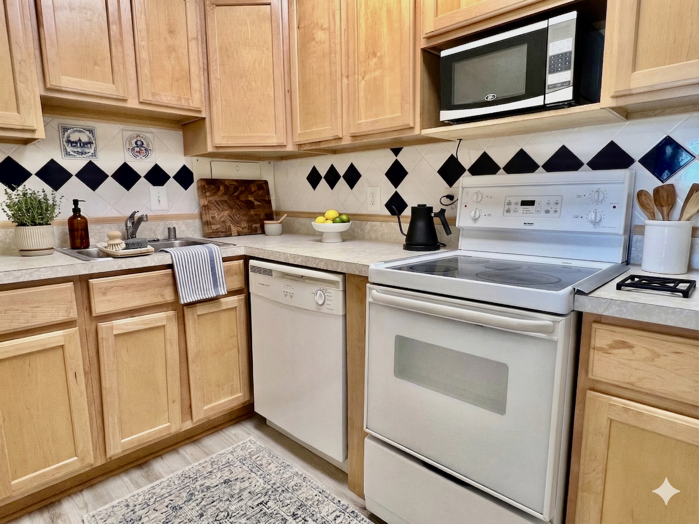 520 N Street Southwest, Unit S622 Washington, DC 20024 - Photo 5 of 25 a kitchen with cabinets appliances and a sink