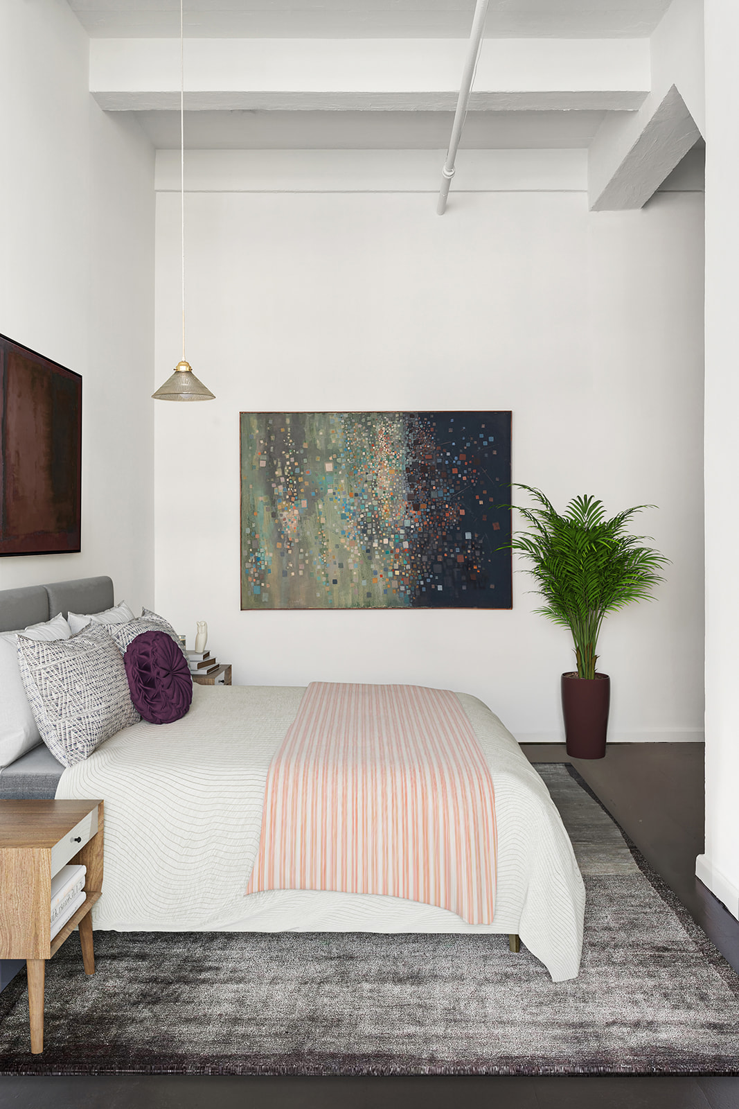 348 West 38th Street, Unit 9E Manhattan, NY 10018 - Photo 6 of 10 a bedroom with a bed and a potted plant