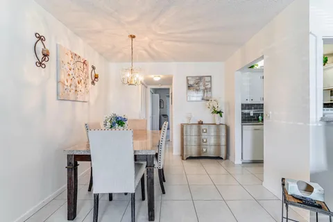 a view of a kitchen and dining room