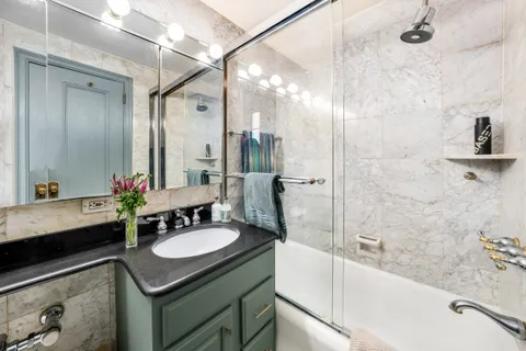 a bathroom with a bathtub and a sink