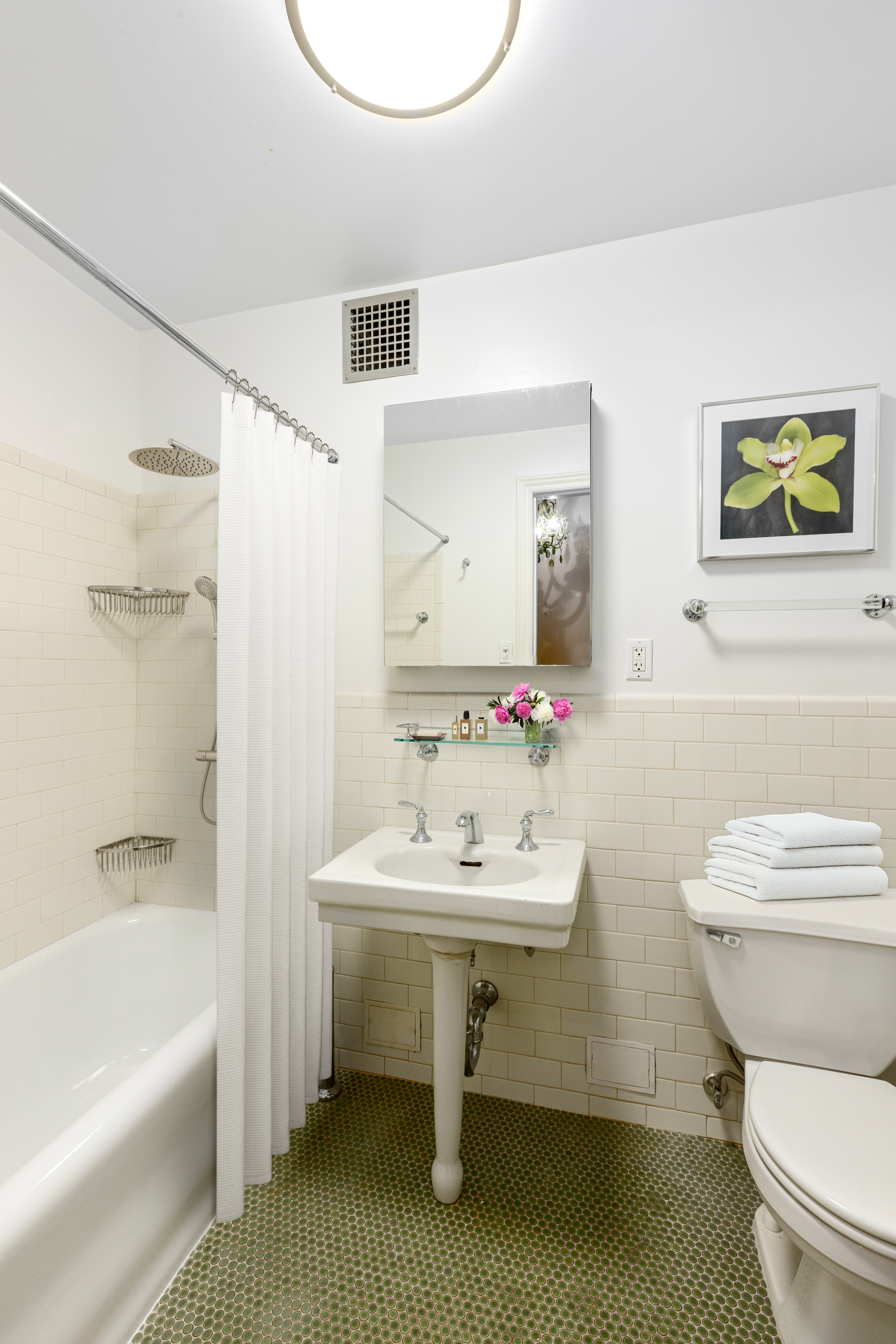 235 West 102nd Street, Unit 3B Manhattan, NY 10025 - Photo 6 of 20 a bathroom with a sink a toilet and a bathtub