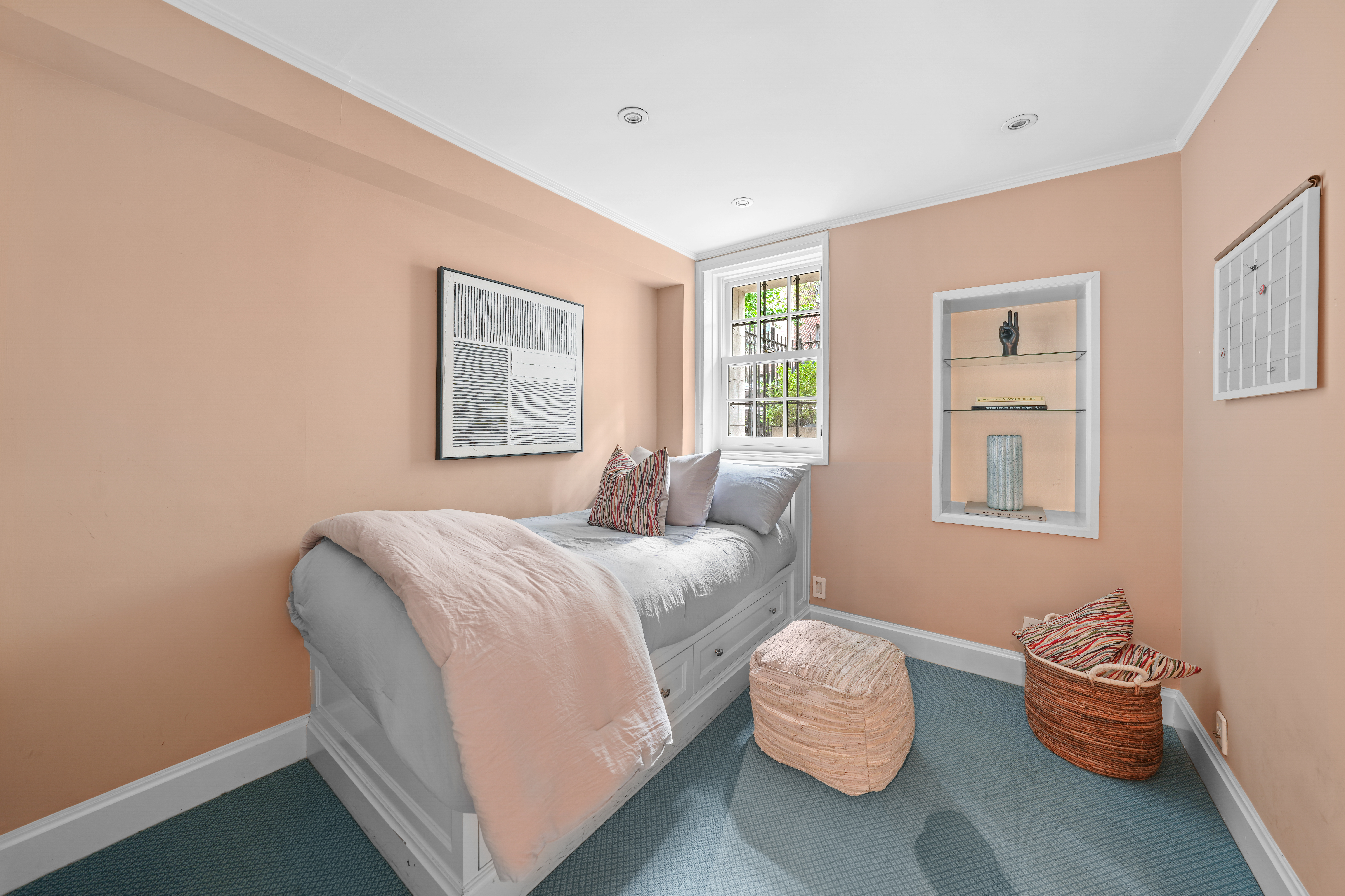 247 East 71st Street Manhattan, NY 10021 - Photo 25 of 31 a bedroom with a bed and window