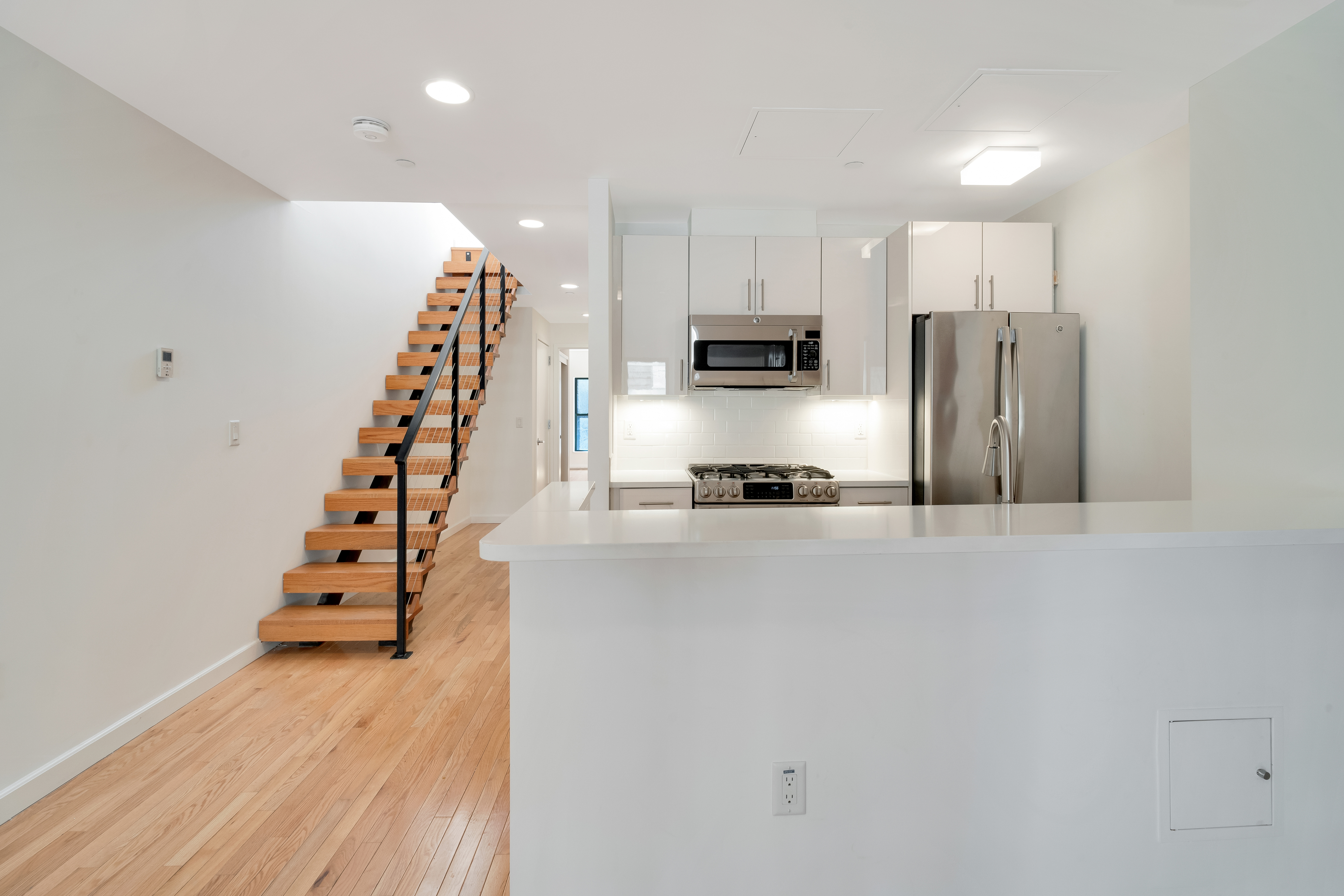 228 West 75th Street, Unit 4 Manhattan, NY 10023 - Photo 3 of 13 a kitchen with stainless steel appliances a refrigerator and a stove top oven