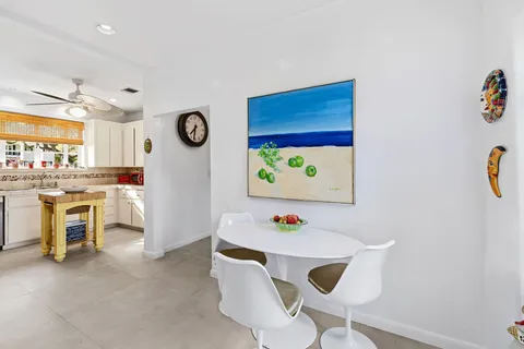a view of kitchen with furniture and wooden floor