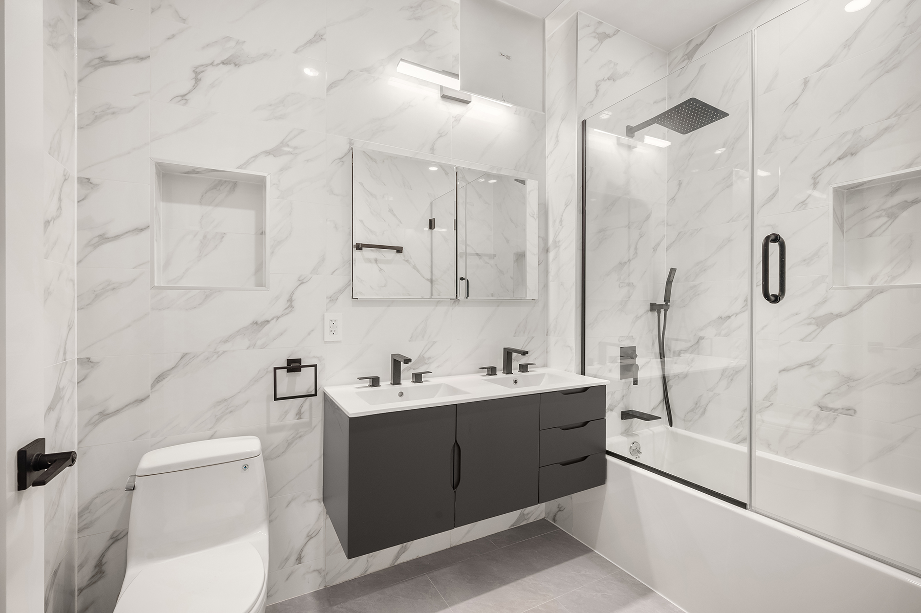 61 West 70th Street, Unit PH Manhattan, NY 10023 - Photo 16 of 18 a bathroom with a double vanity sink toilet and shower