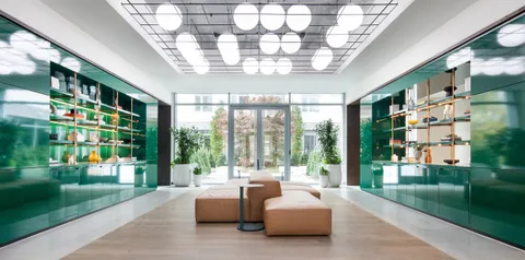 a view of a lake with boats and trees in the background