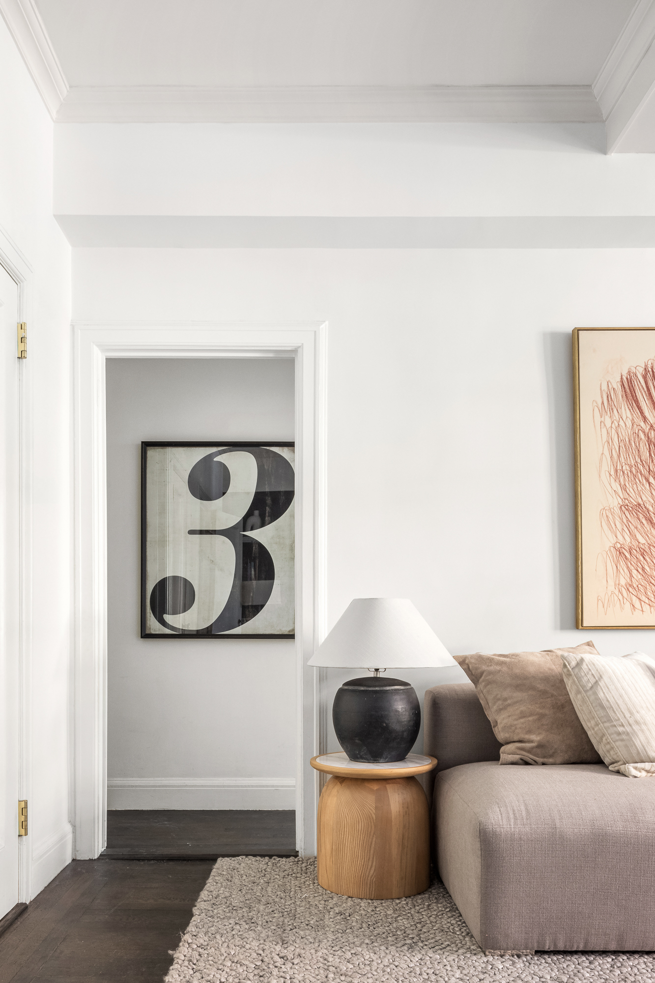 39 5th Avenue, Unit 2B Manhattan, NY 10003 - Photo 7 of 12 a living room with furniture and wall painting
