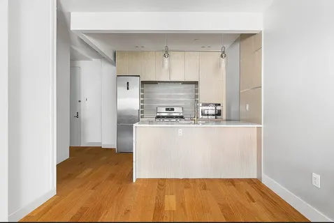 a view of kitchen with wooden floor