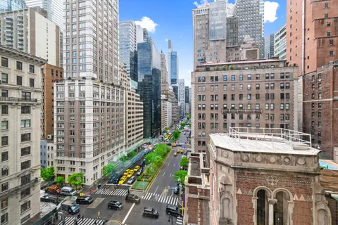 a view of swimming pool with outdoor seating
