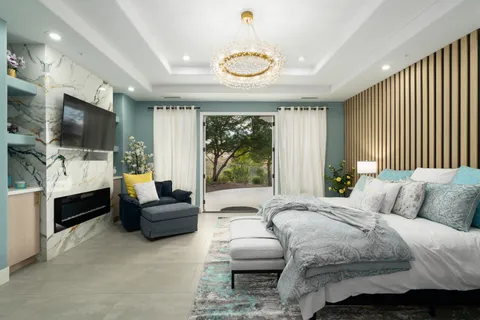 a view of a terrace with couches and city view