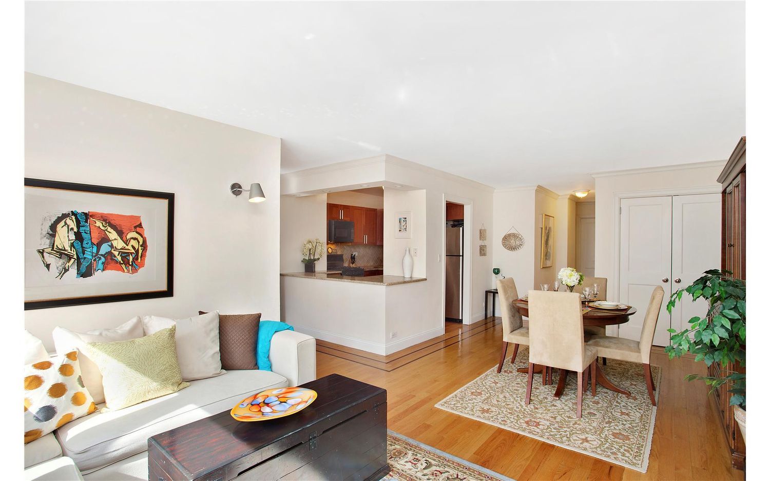 333 East 34th Street, Unit 5L Manhattan, NY 10016 - Photo 2 of 8 a living room with furniture and wooden floor